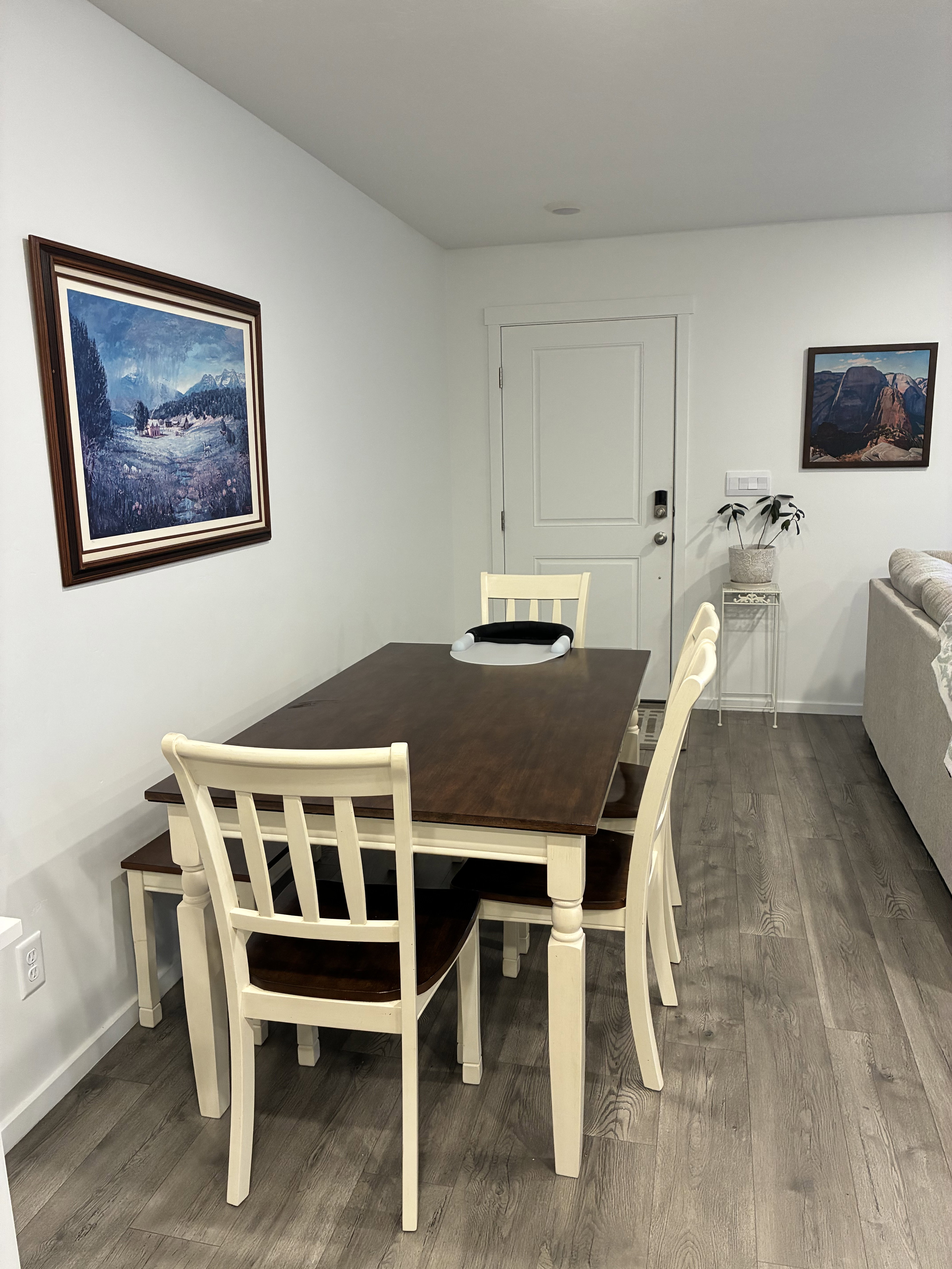 Dining area featuring wood-finish flooring, white walls, and a recessed ceiling light