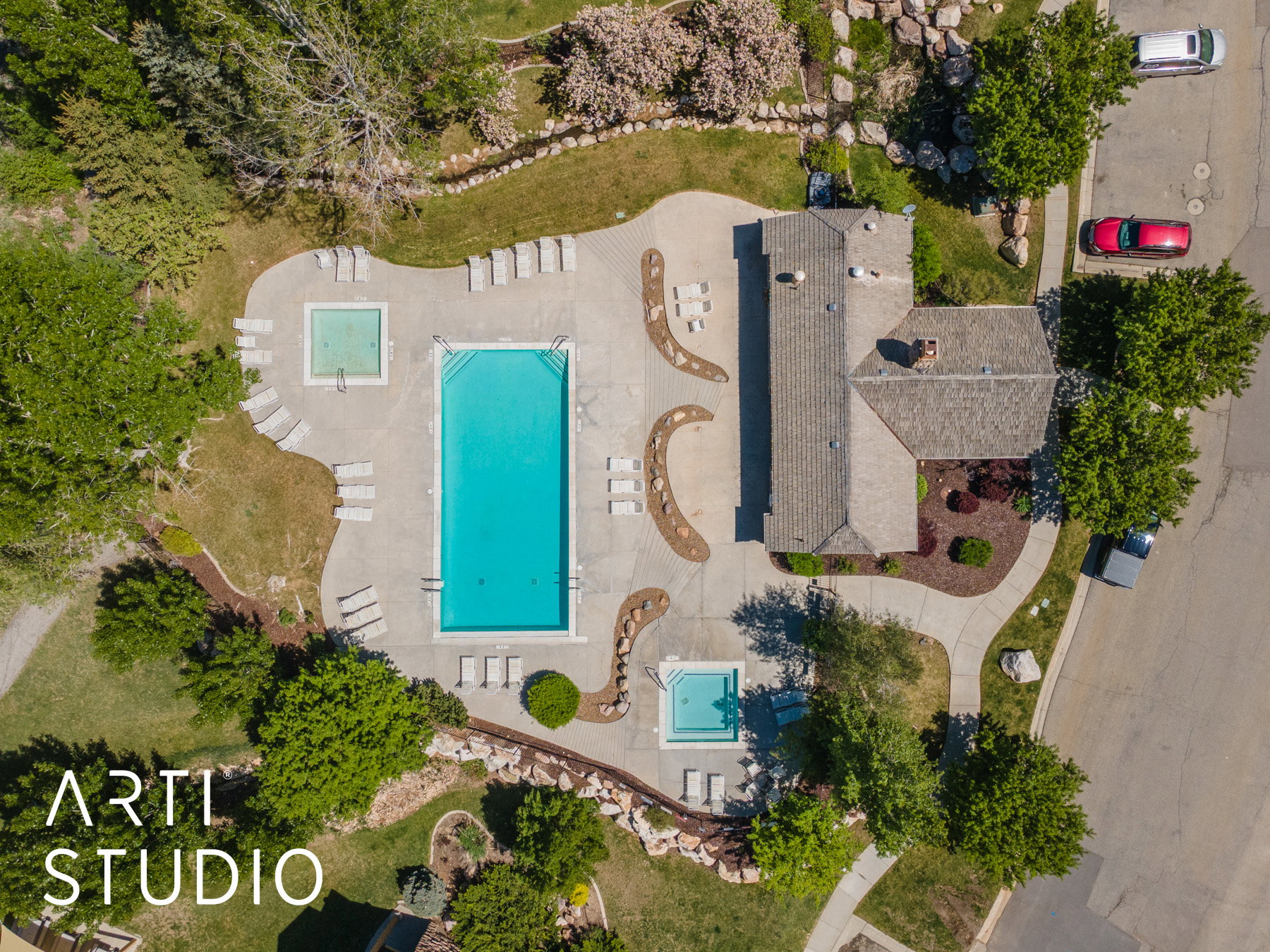 Aerial view of pool and community hot tub, and adjoining sauna area