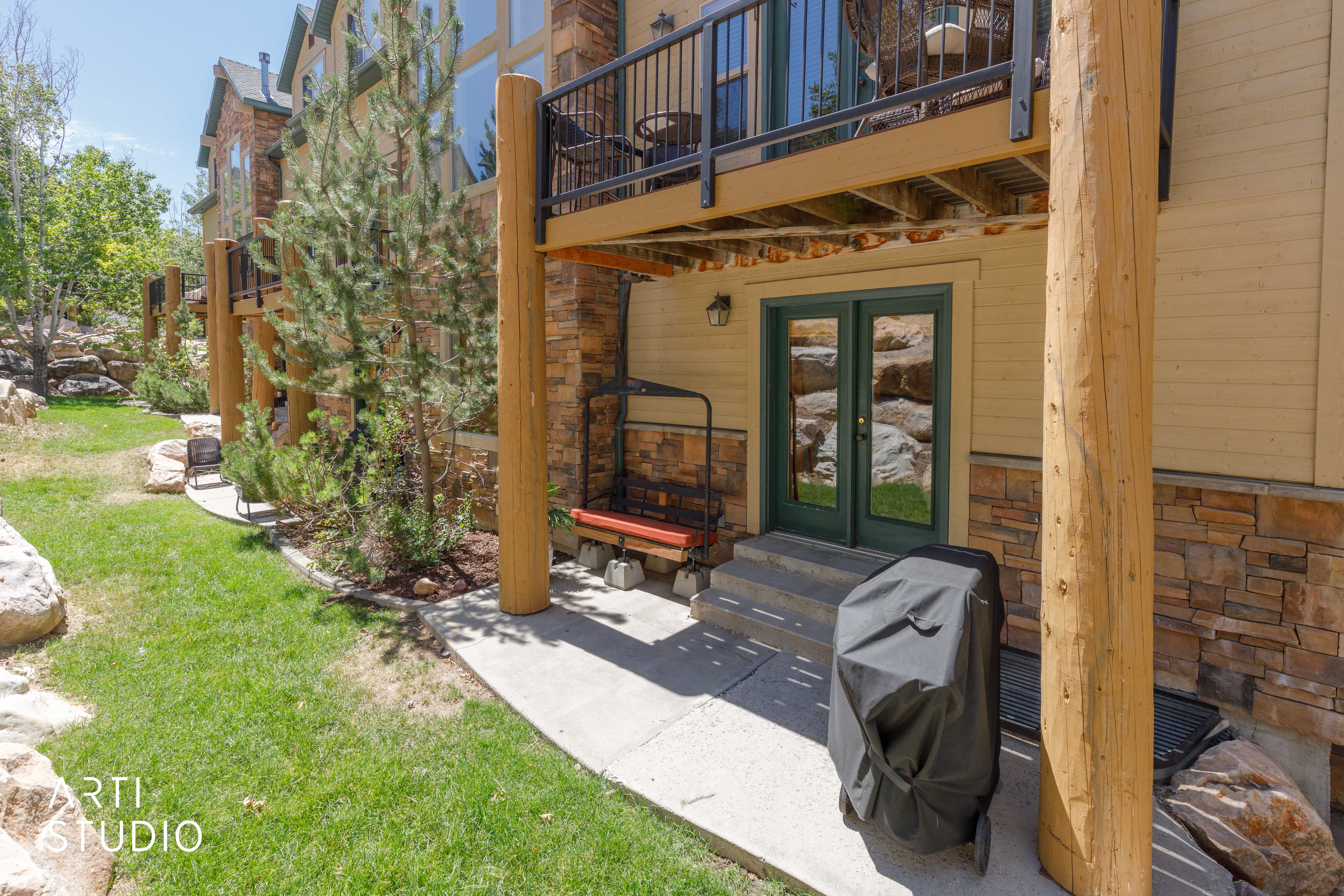Private patio area with ski lift and Weber grill