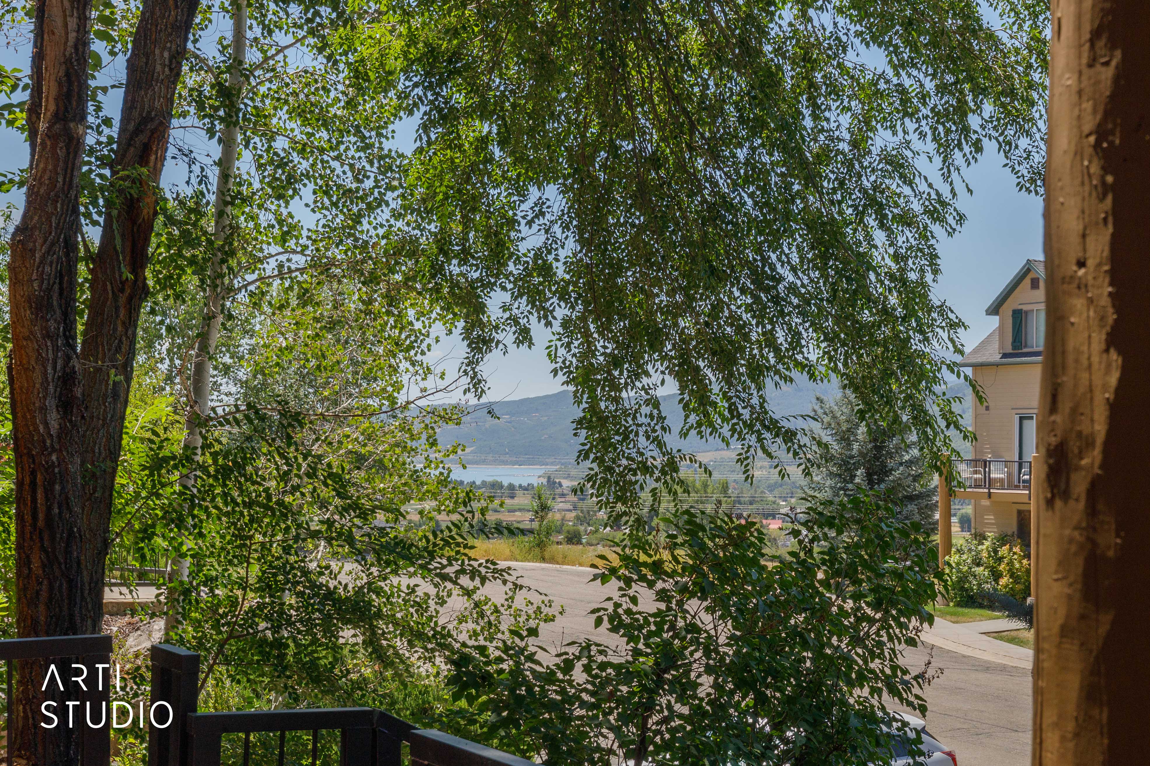 Mature trees frame  views of Pineview and snowbasin from the front porch