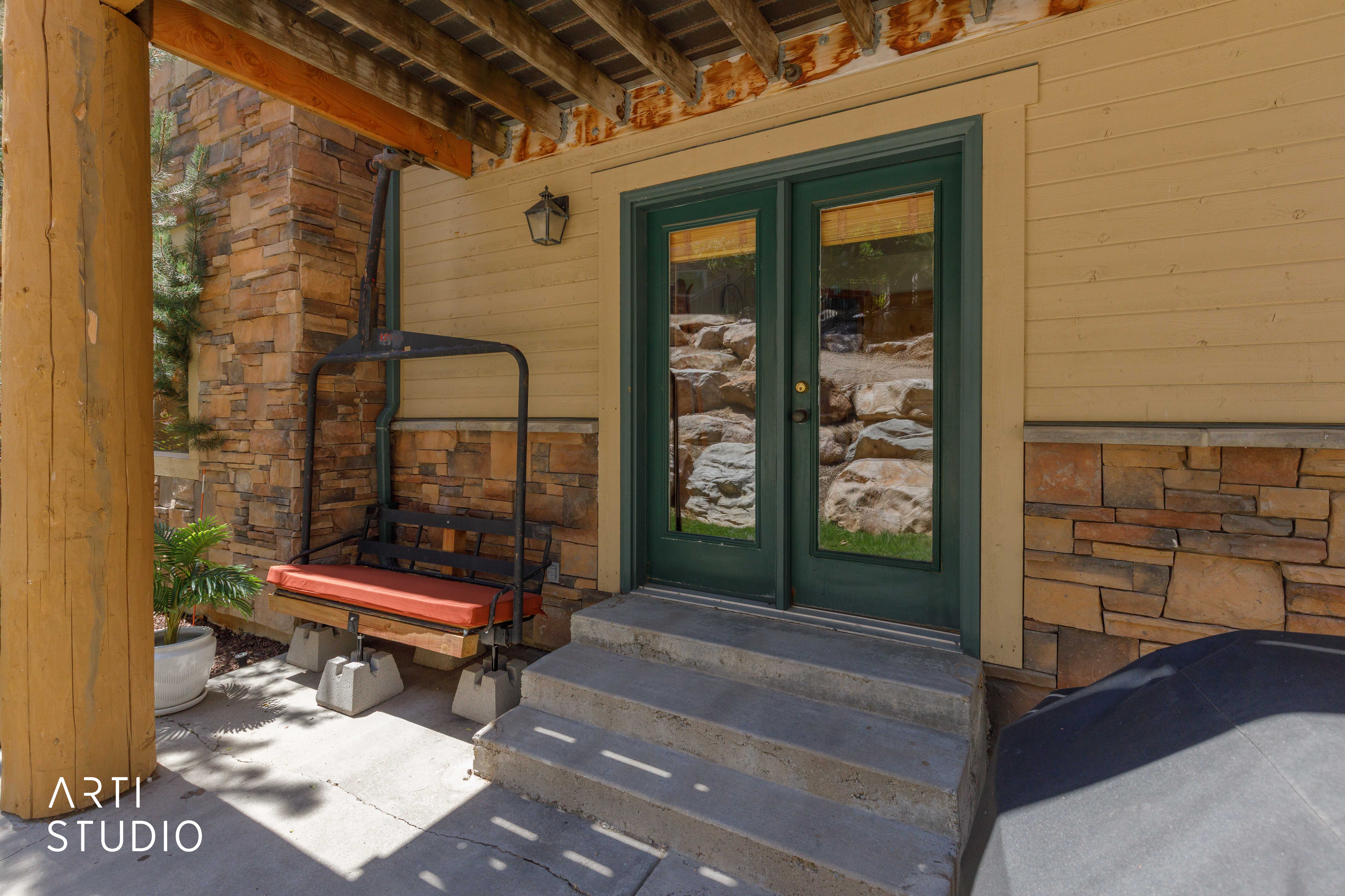 Rear patio featuring sitting area and ski lift chair