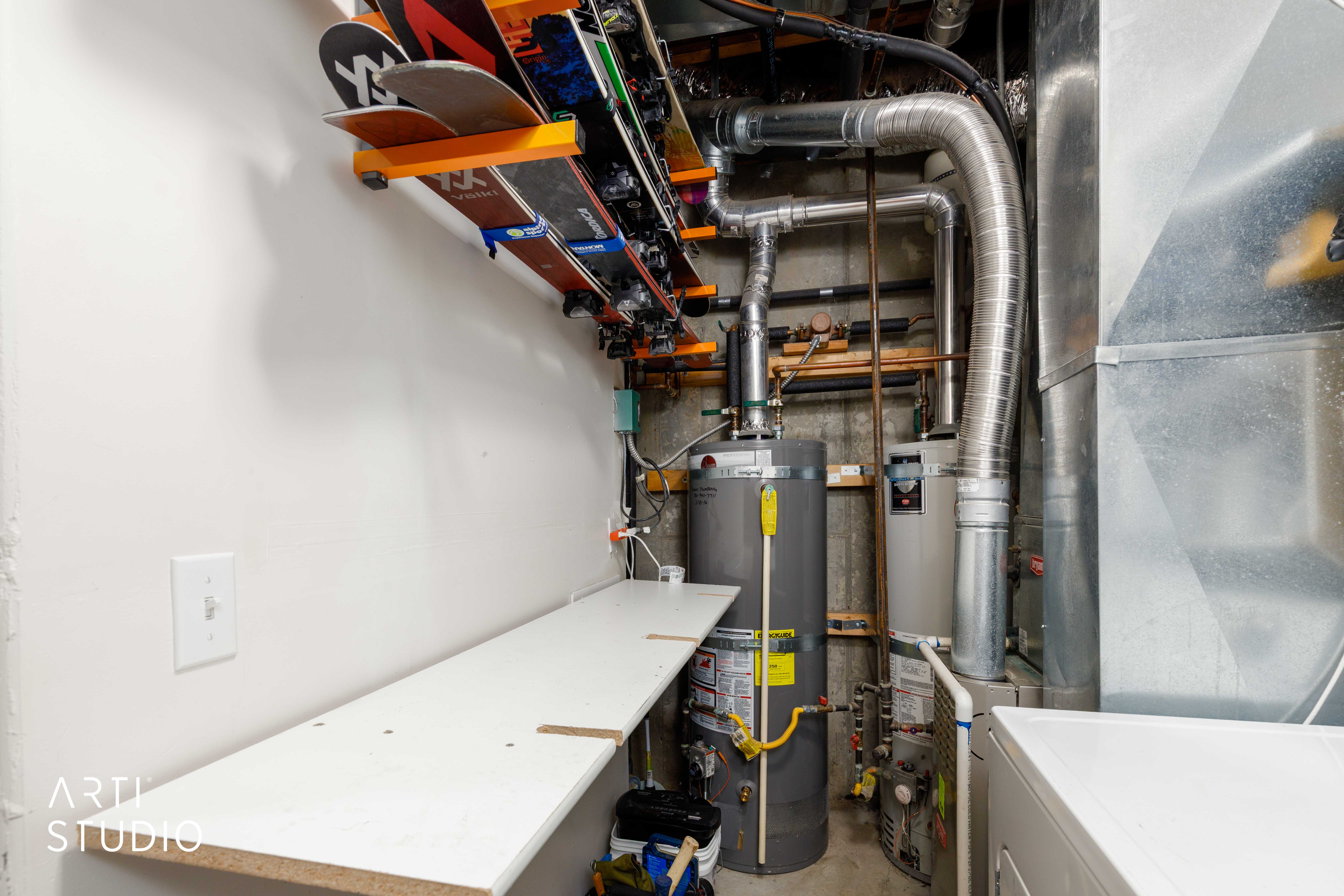 Drop down work bench and indoor ski rack