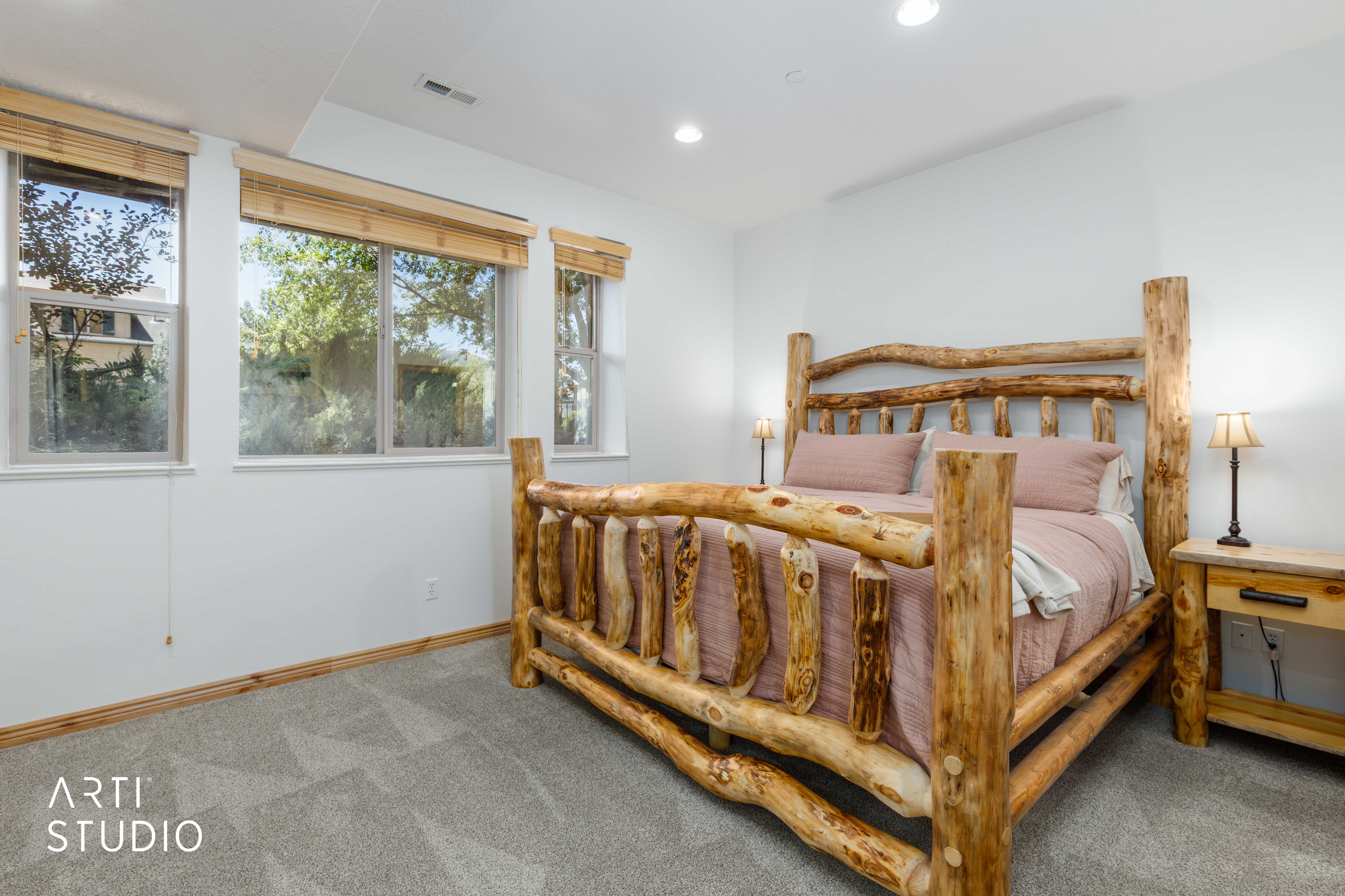Primary bedroom with King size bed, with recessed lighting and multiple windows