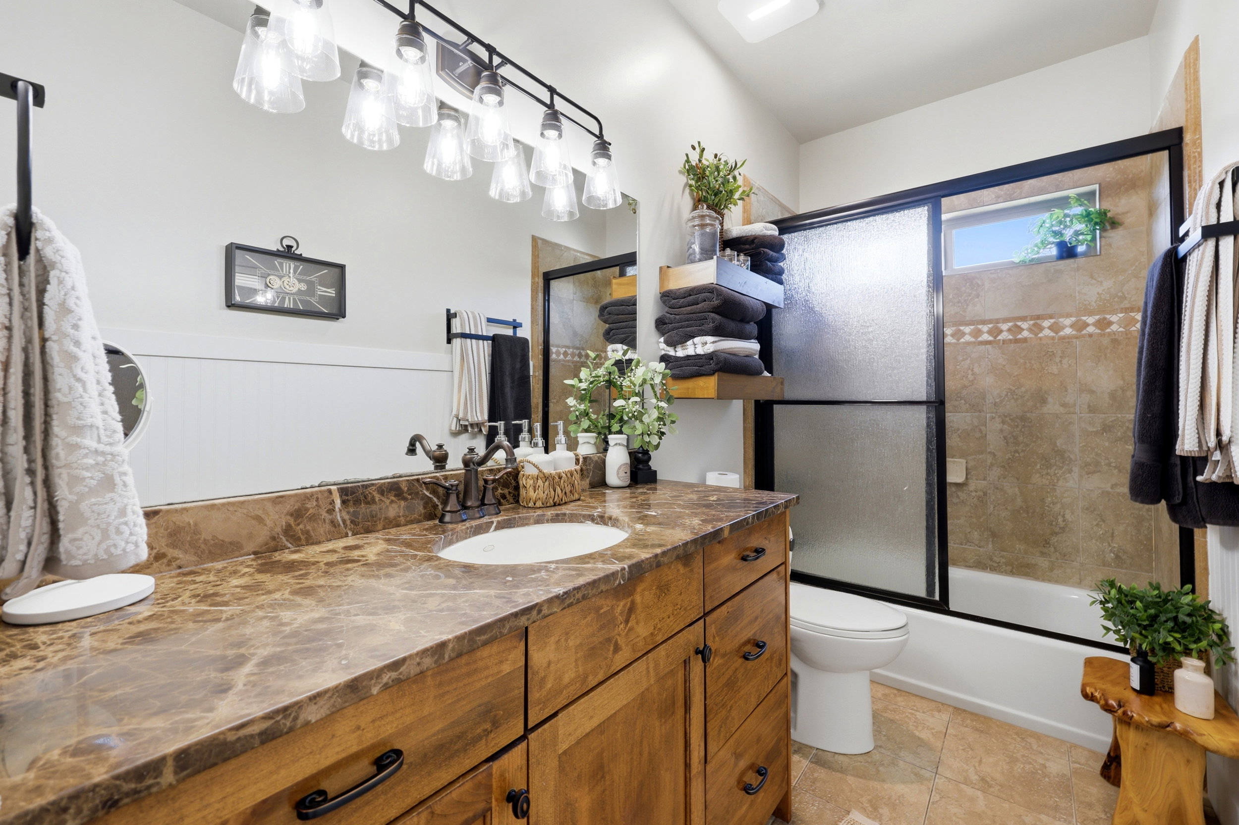 Double vanity with a stone countertop and integrated sinks