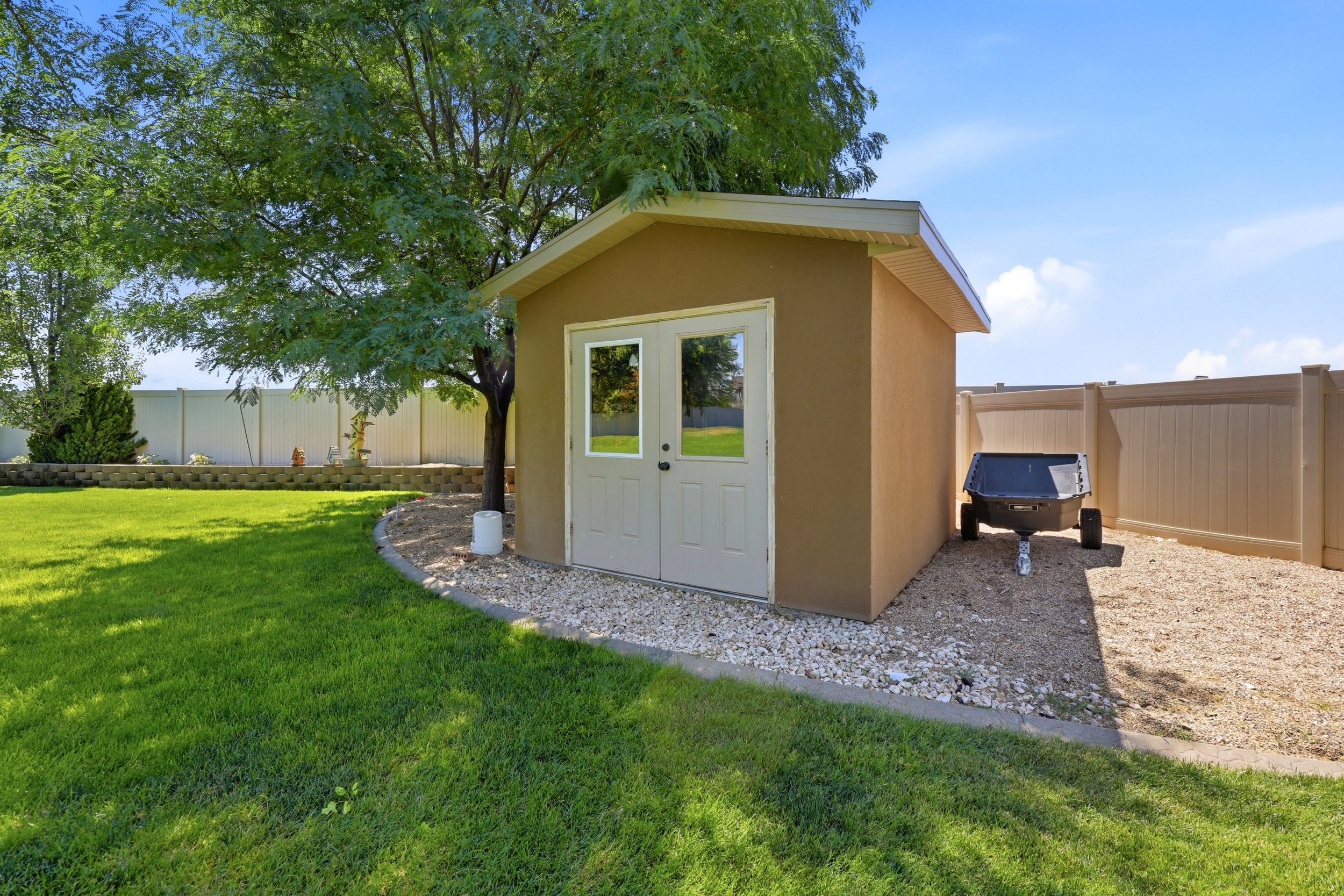 Exterior storage shed with double glass-paneled doors