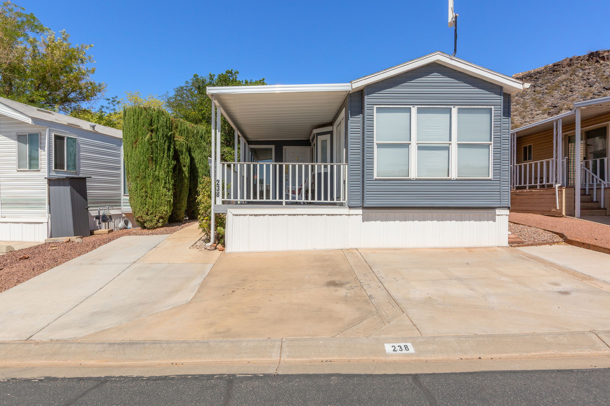 Blue siding exterior with white trim