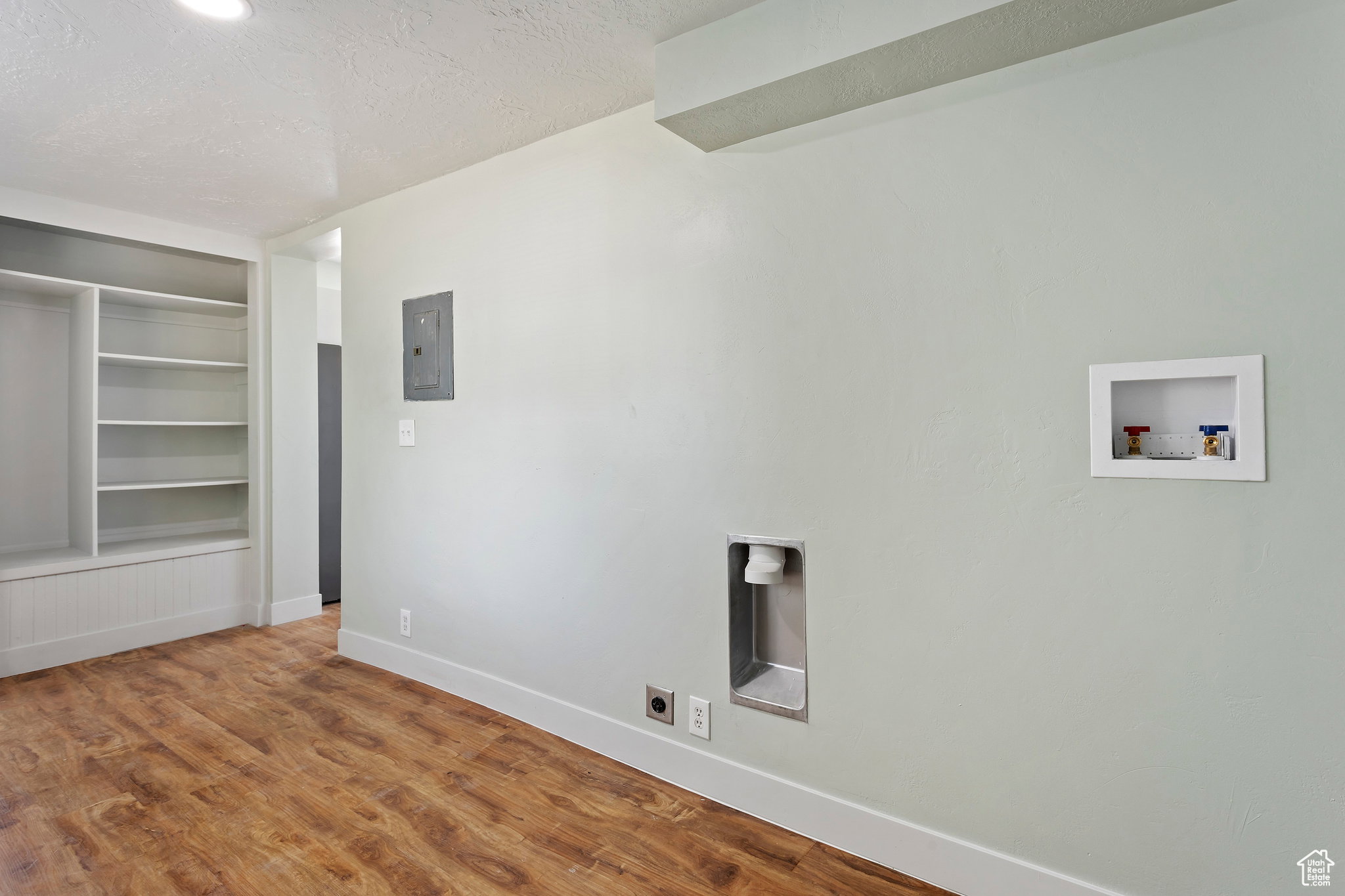 Dedicated laundry area featuring a utility box and washer/dryer hookups