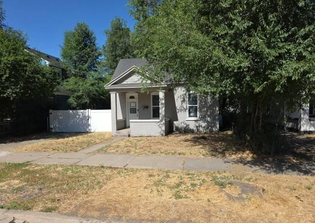 Gray exterior with white trim and a covered front porch