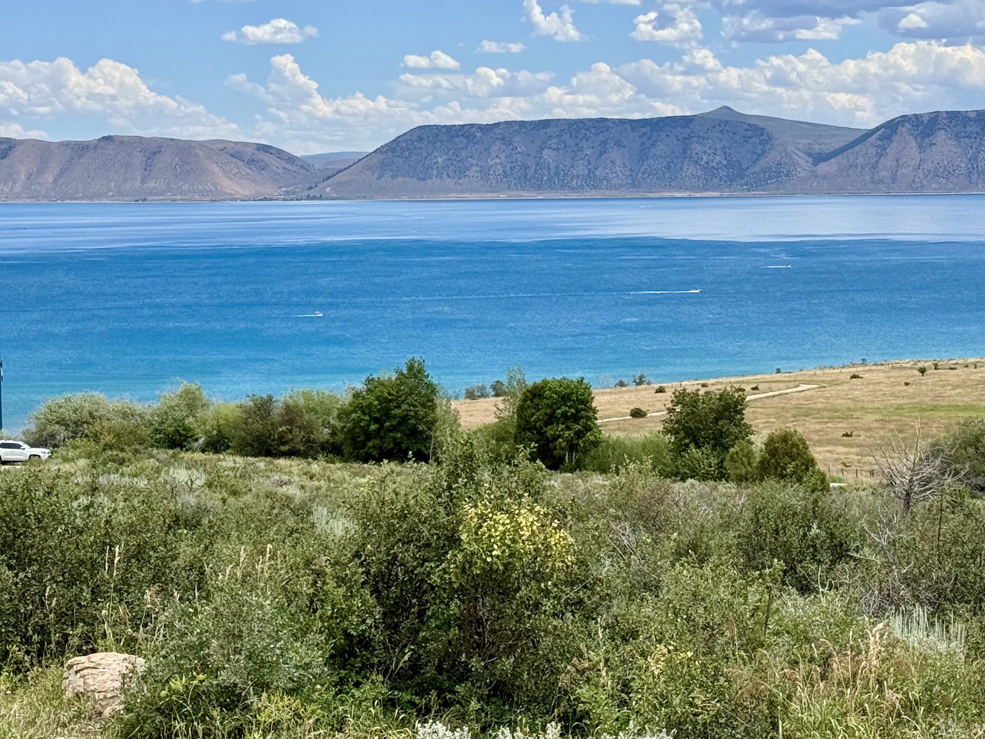Expansive water body with surrounding mountains