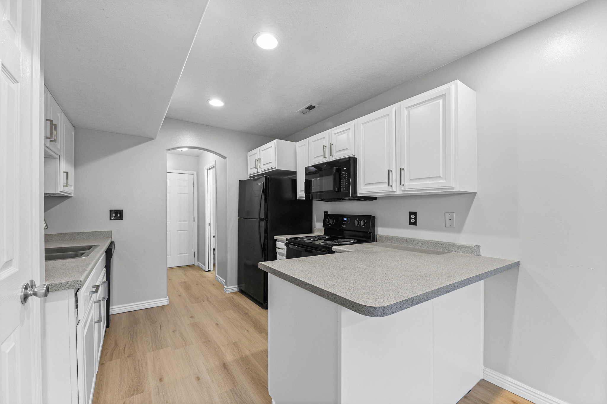 Updated White Kitchen with Bar Area