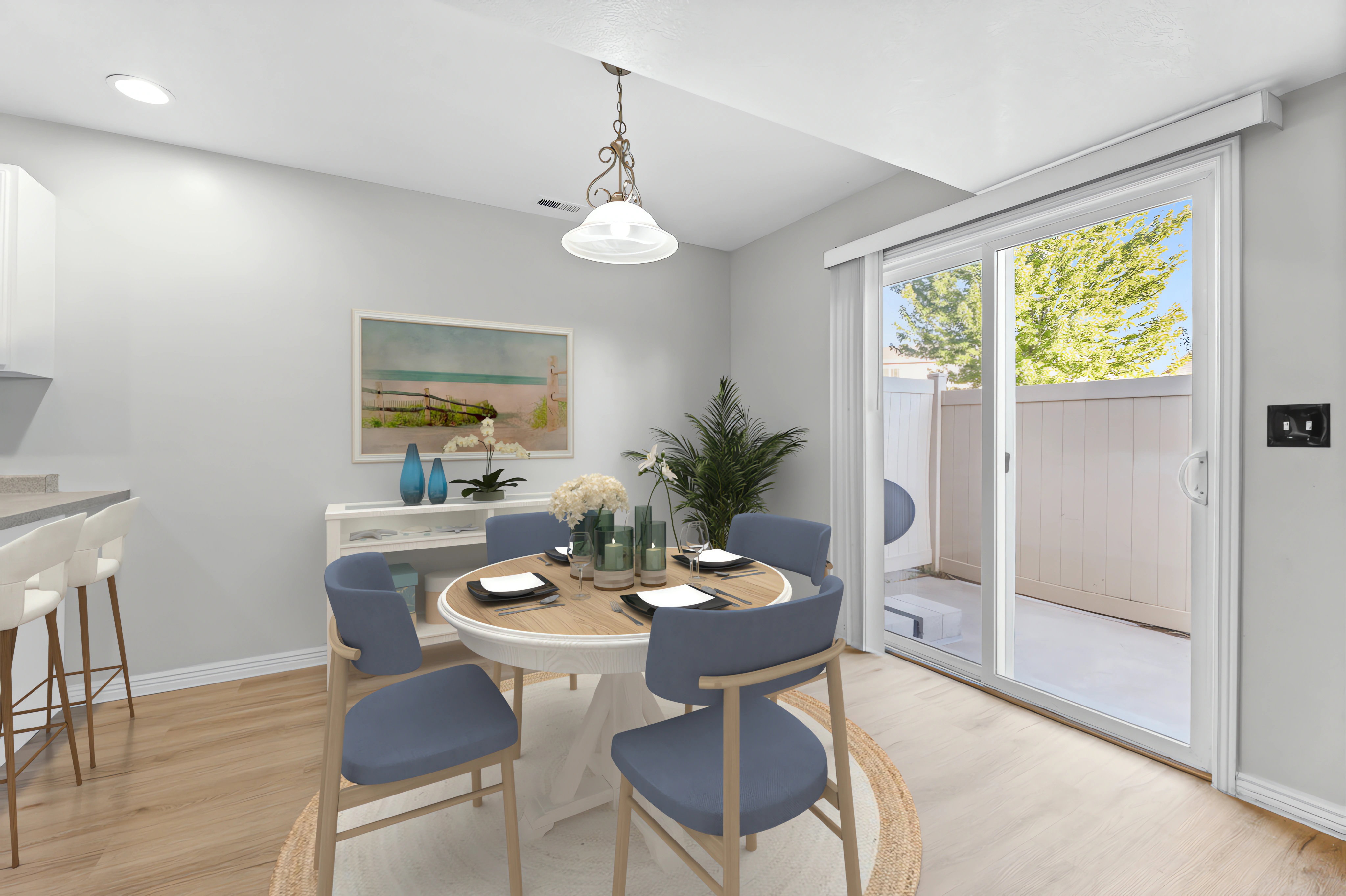 Virtually Staged Dining area with Doors to Patio
