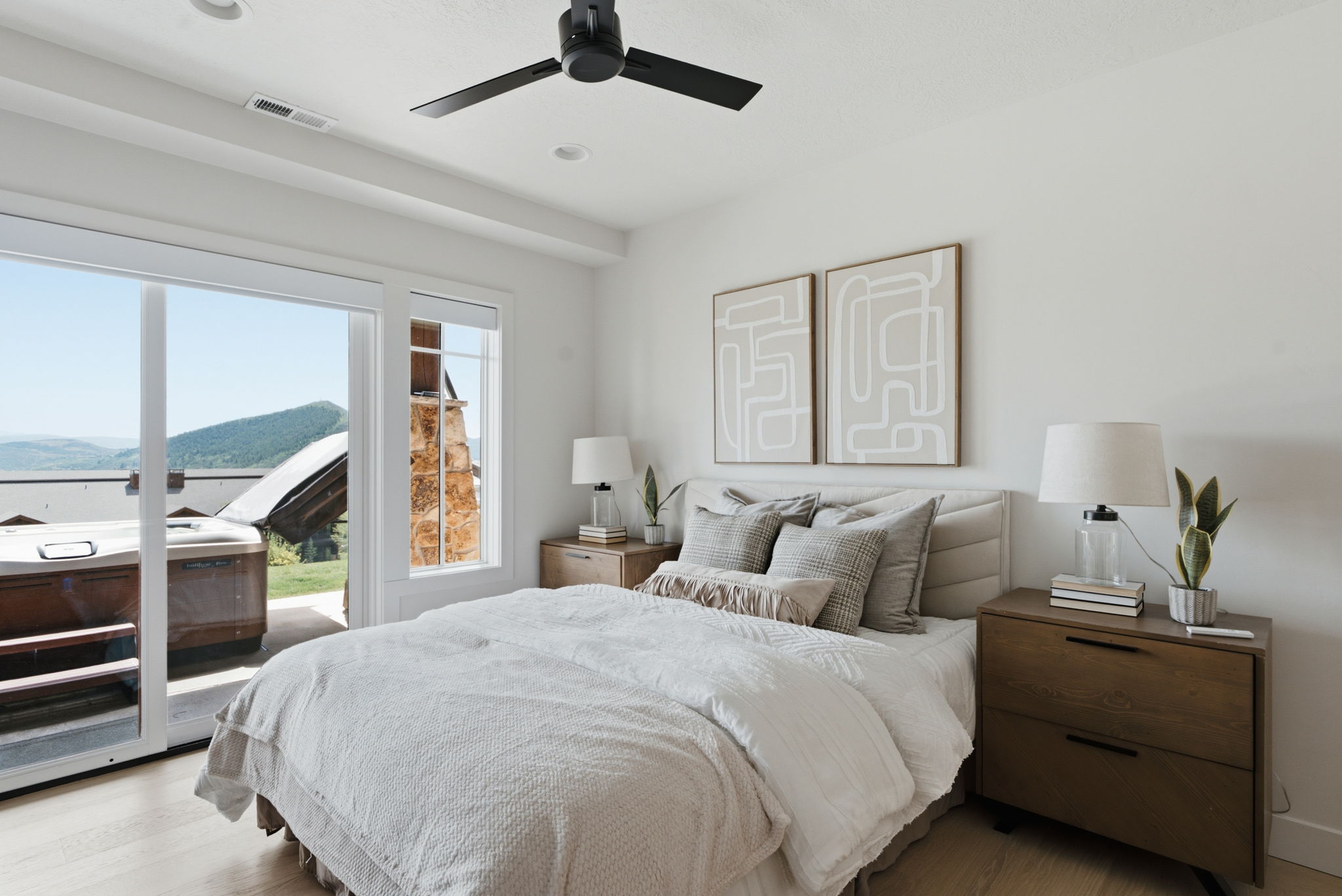 Room featuring wood-finish flooring and a contemporary ceiling fan