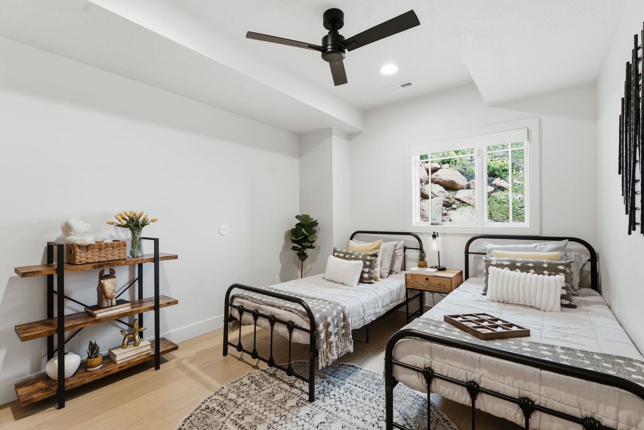 3rd Bedroom featuring light wood-finish flooring, a contemporary ceiling fan, and a white-framed window