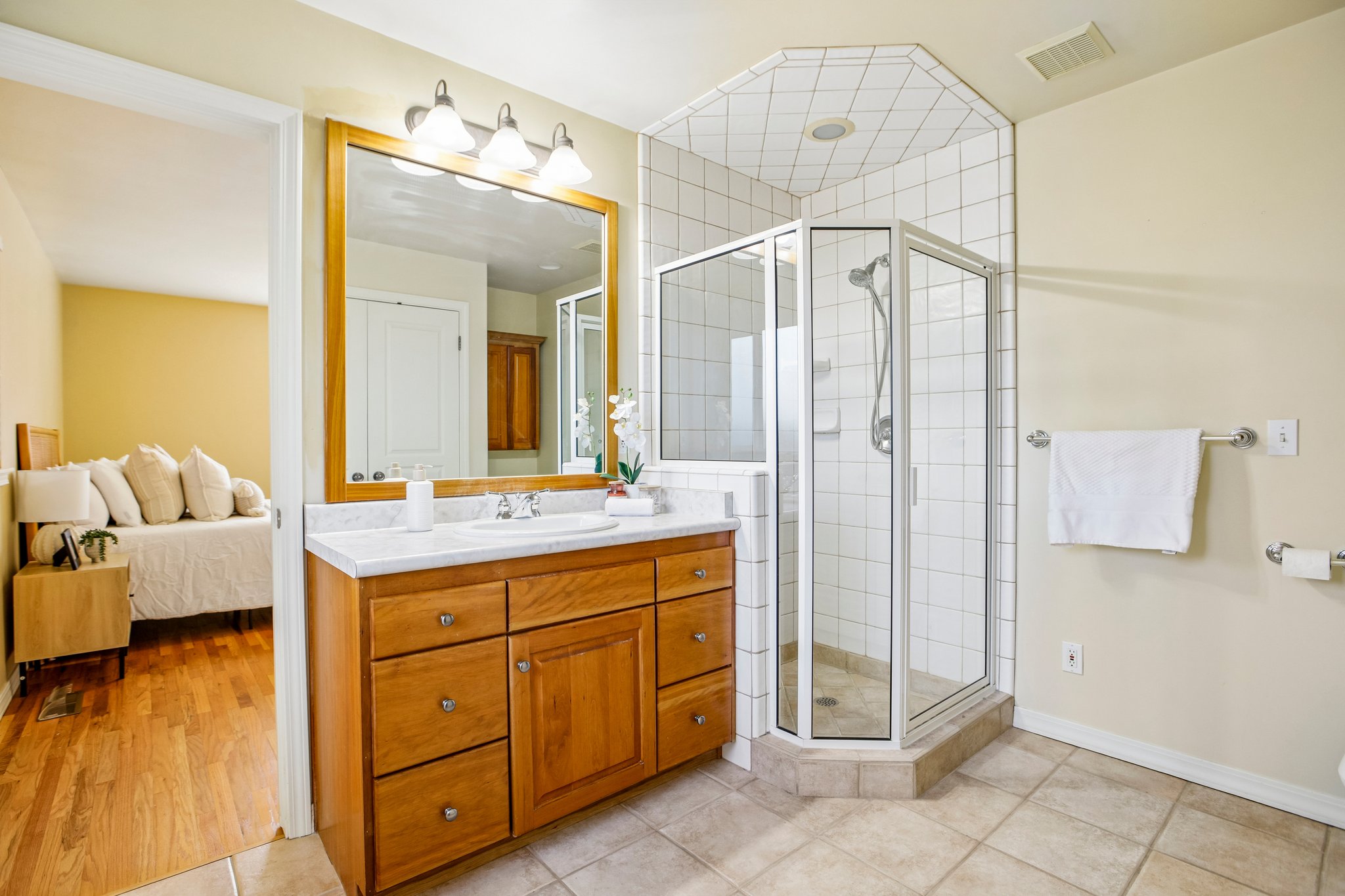 Bathroom featuring a single vanity with wood cabinetry and a white countertop