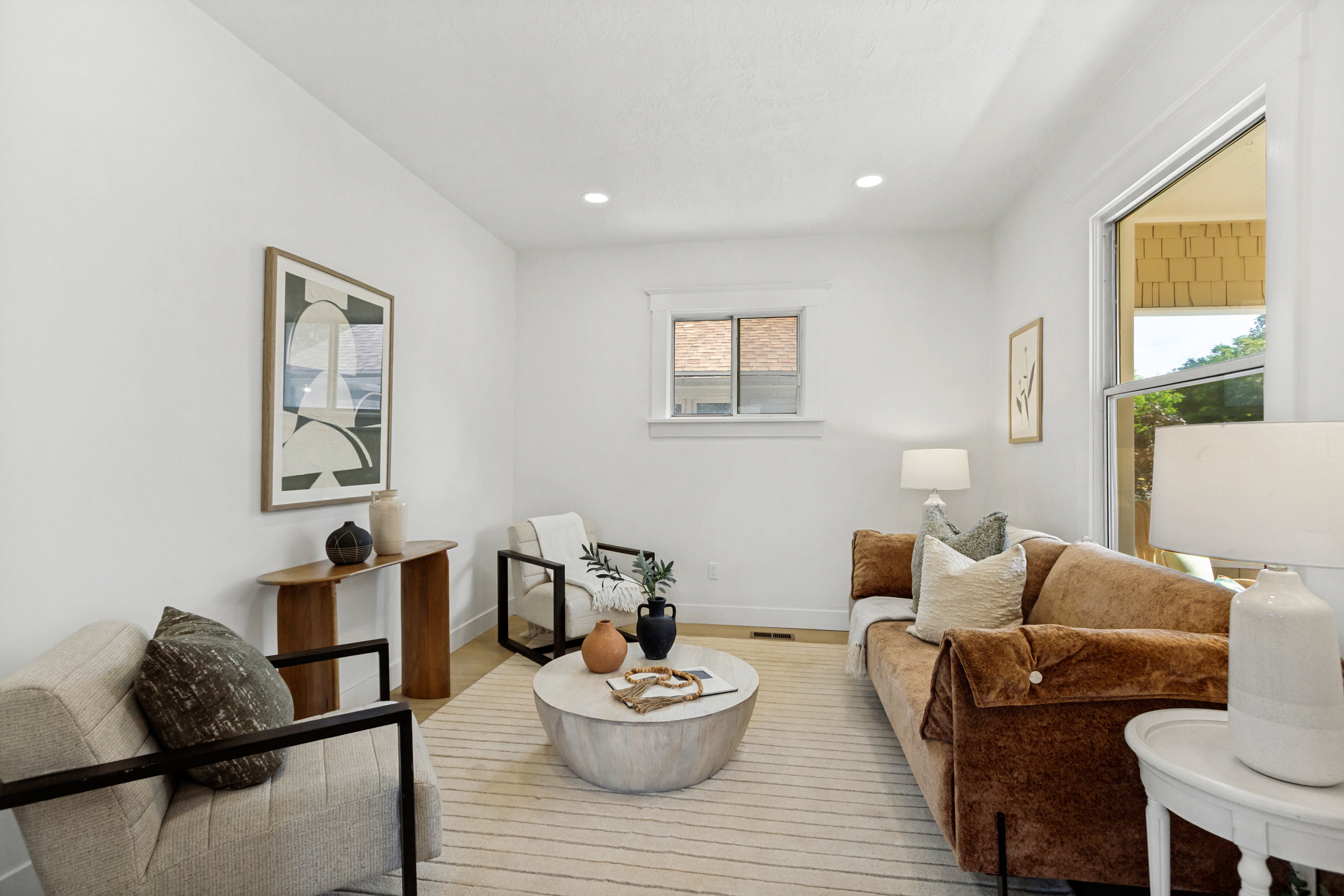 Bright living area featuring recessed lighting and wood-finish flooring
