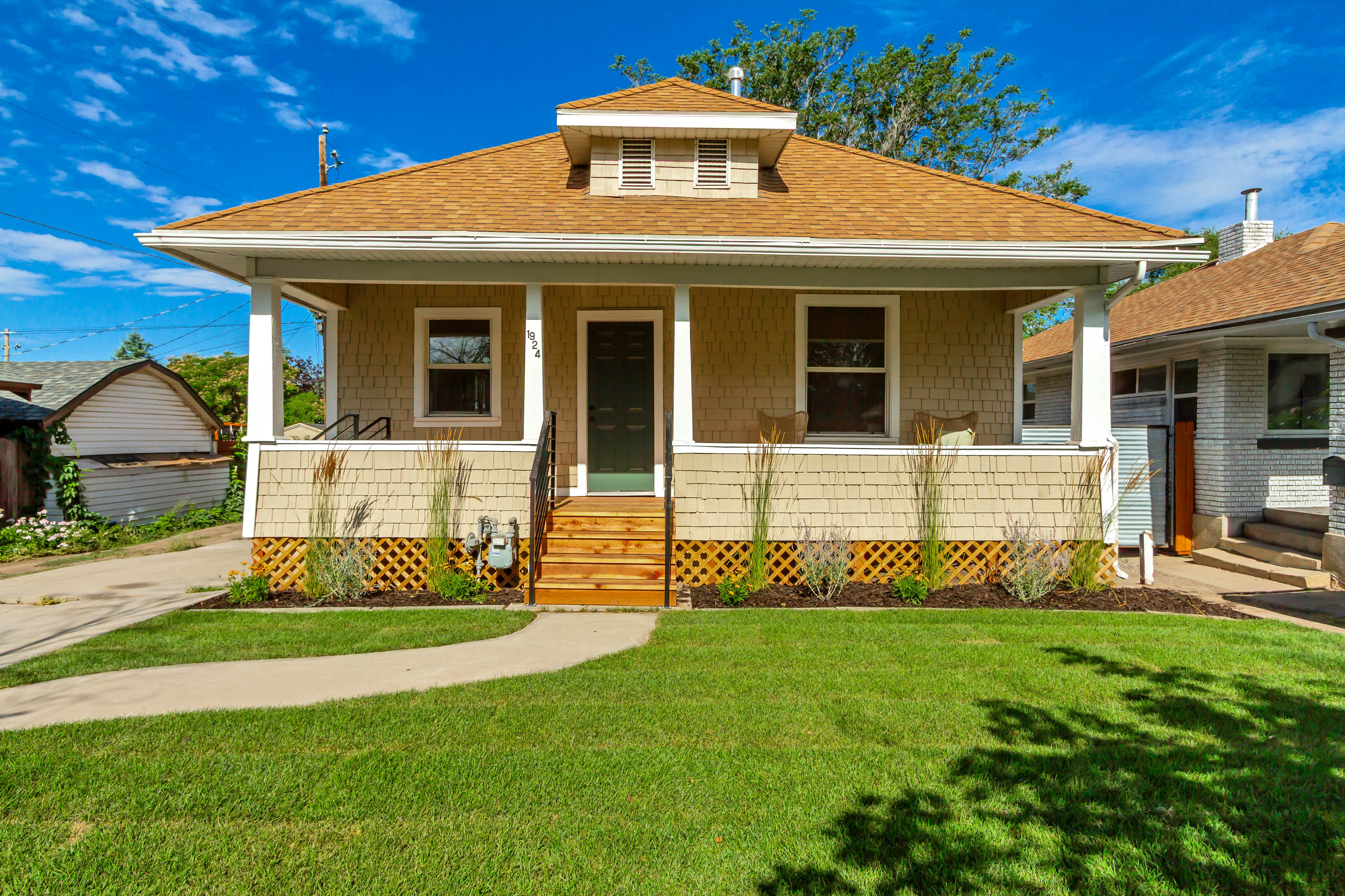 Craftsman-style facade featuring shake siding and a gabled roof