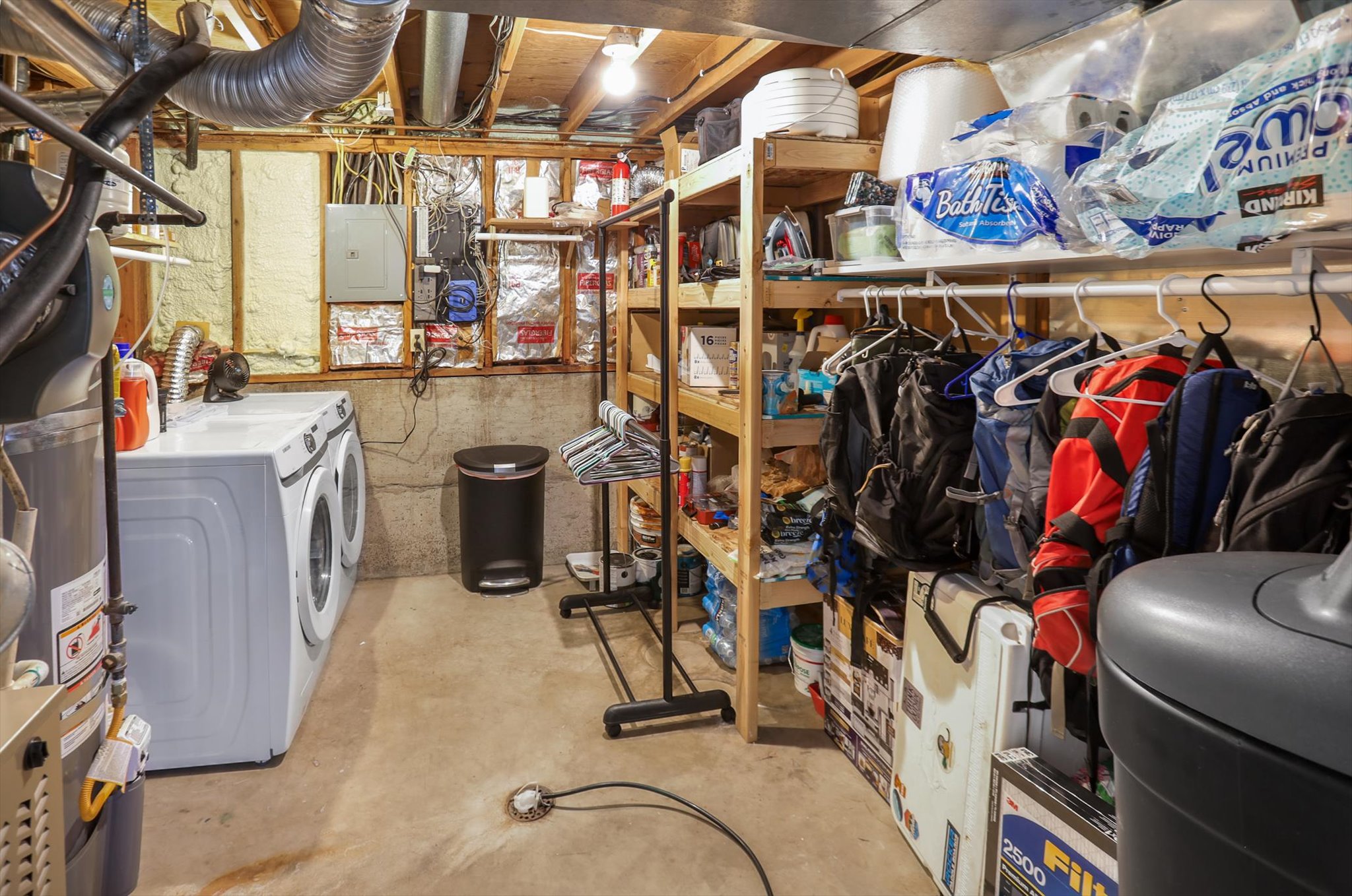 Dedicated laundry area with a side-by-side washer and dryer unit