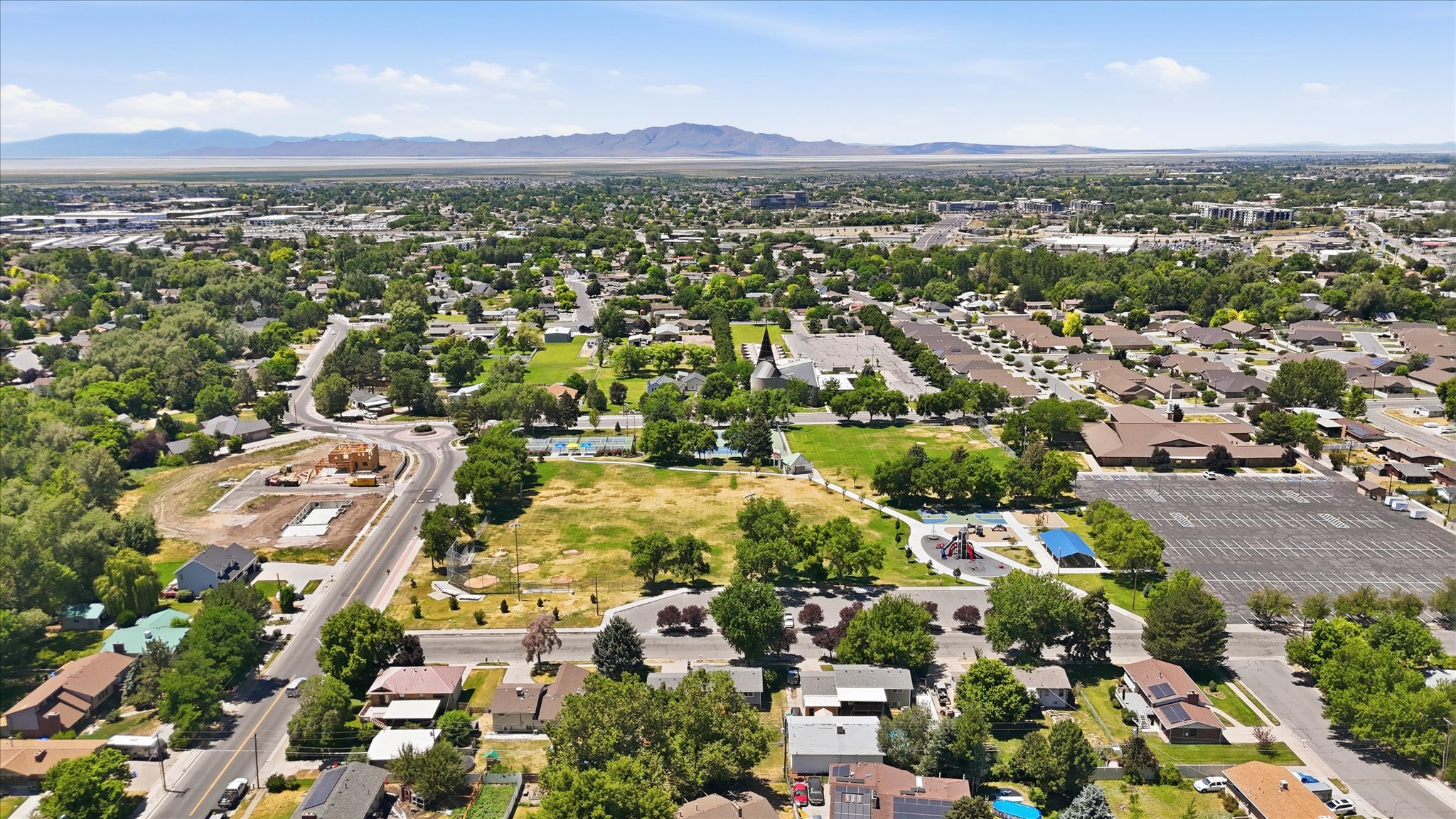 Expansive aerial view of a residential neighborhood with a variety of single-family homes and mature trees
