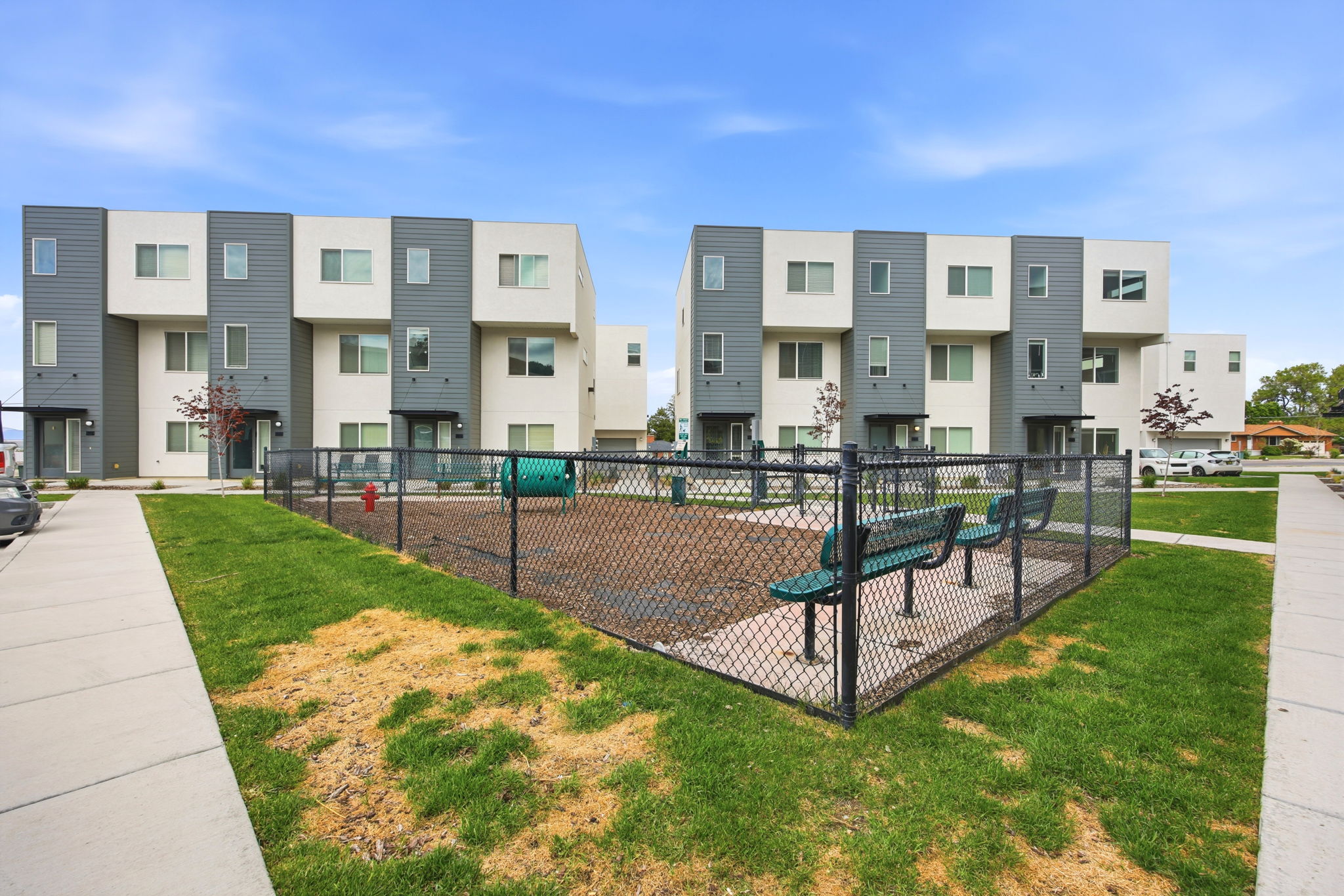 Modern multi-level townhome exteriors featuring clean lines and a contemporary color palette