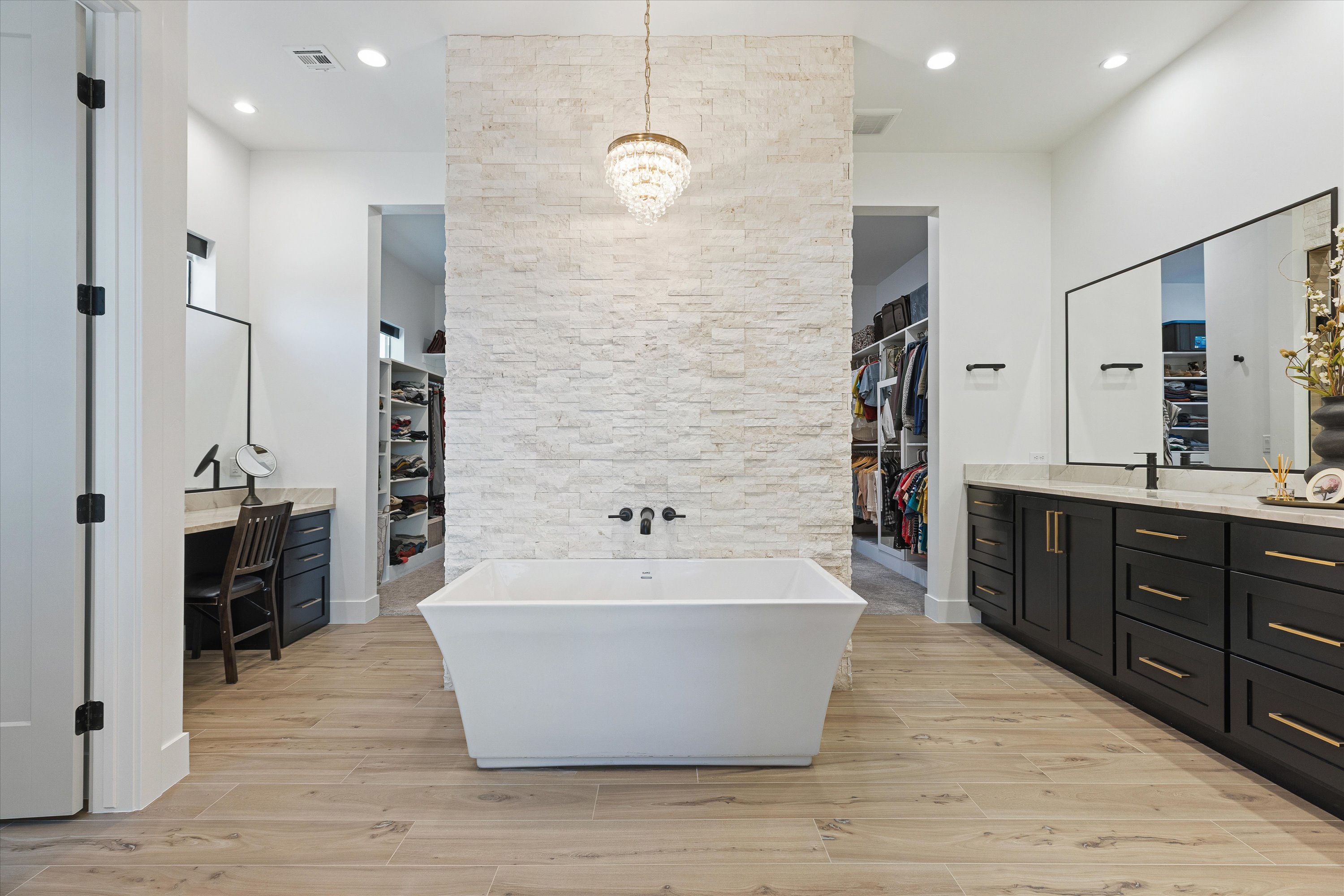 Primary Bathroom with Freestanding Soaking Tub with a Chandelier, Dual Sinks & Separate Makeup Vanity