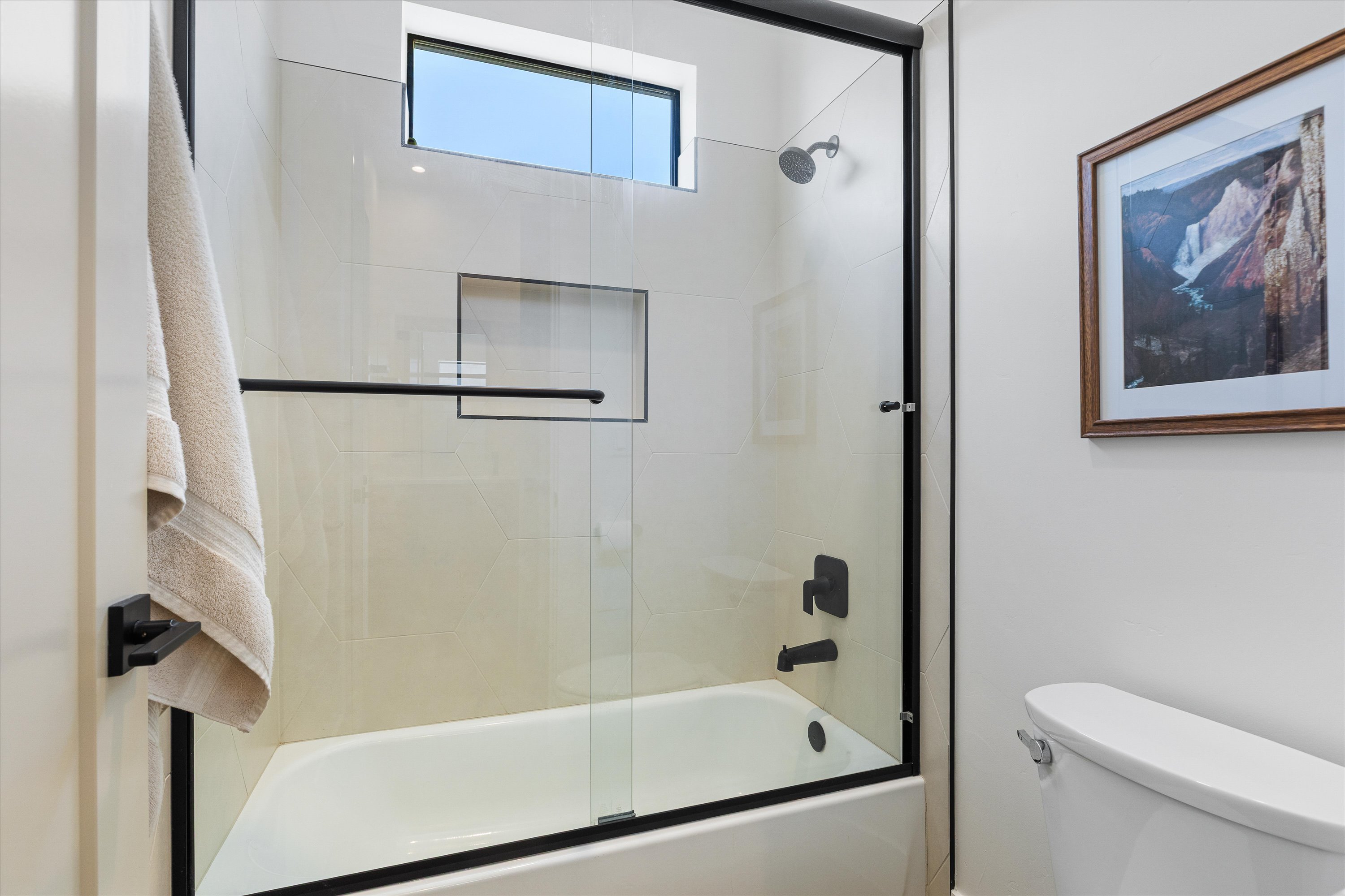 Jack & Jill's Bathroom's Tub Shower with Door