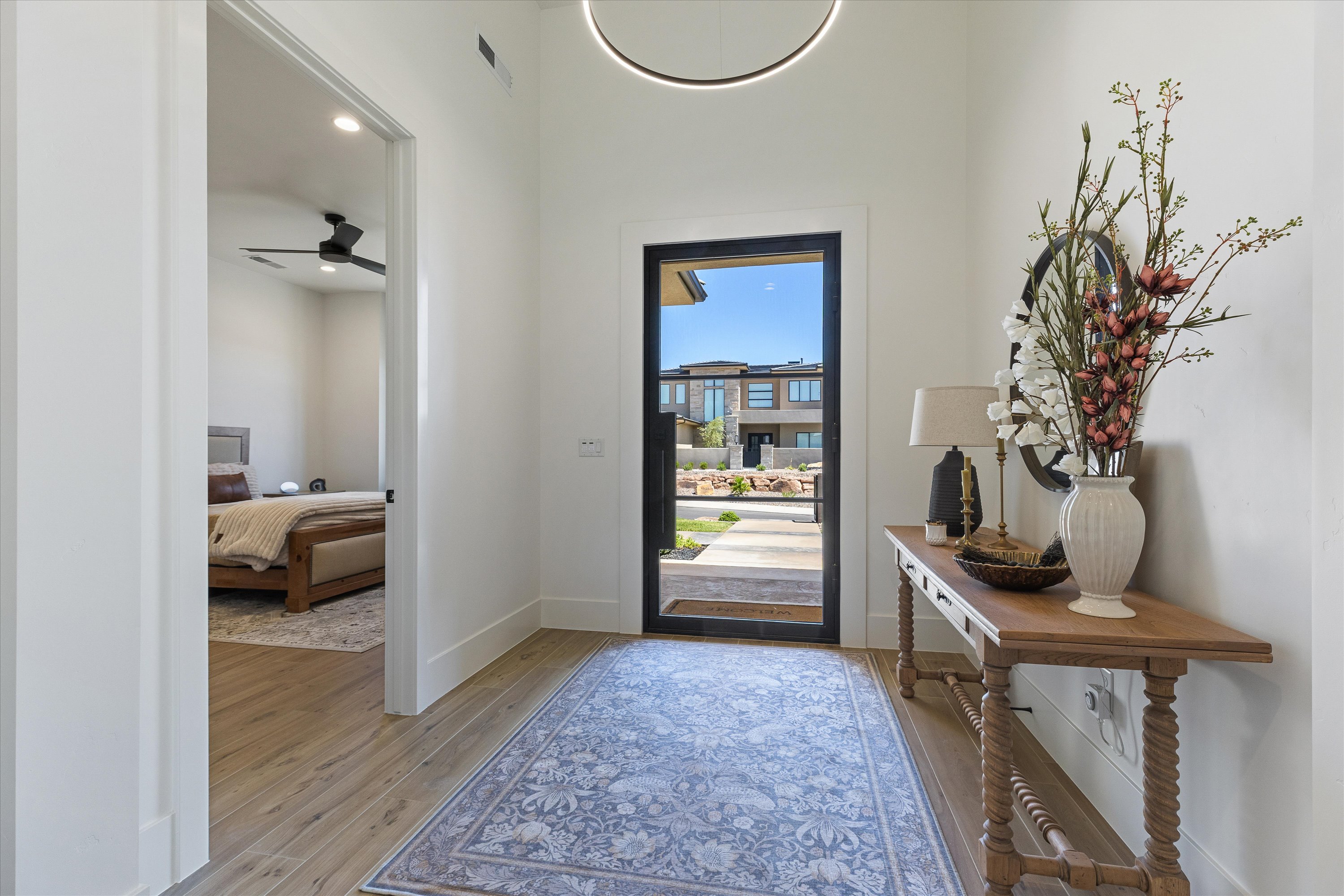 Foyer with Iron Door and Smart Lighting Panel
