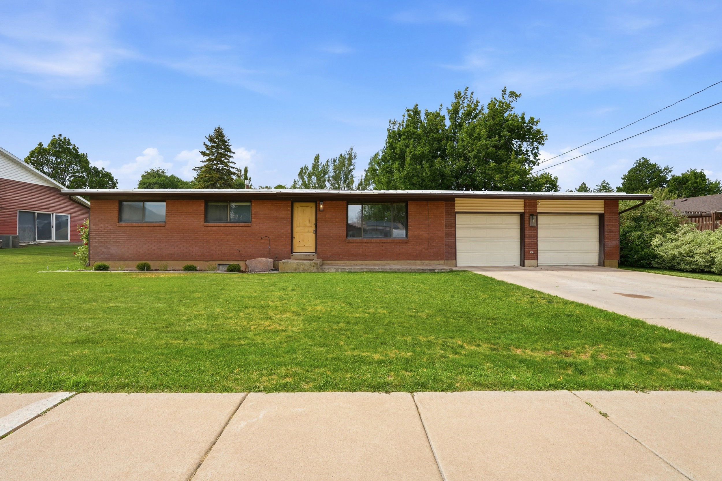 Brick exterior with a prominent two-car garage