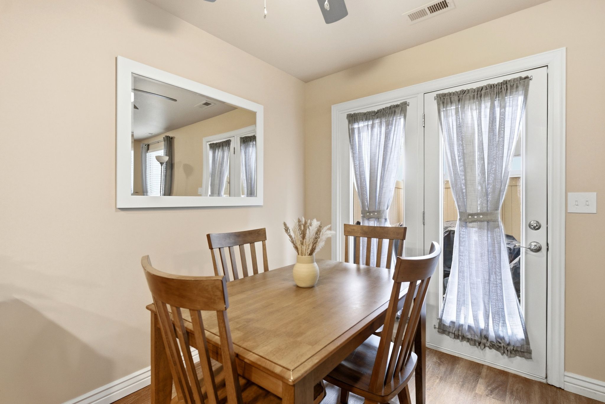 Dining space featuring wood finished floors and ceiling fan