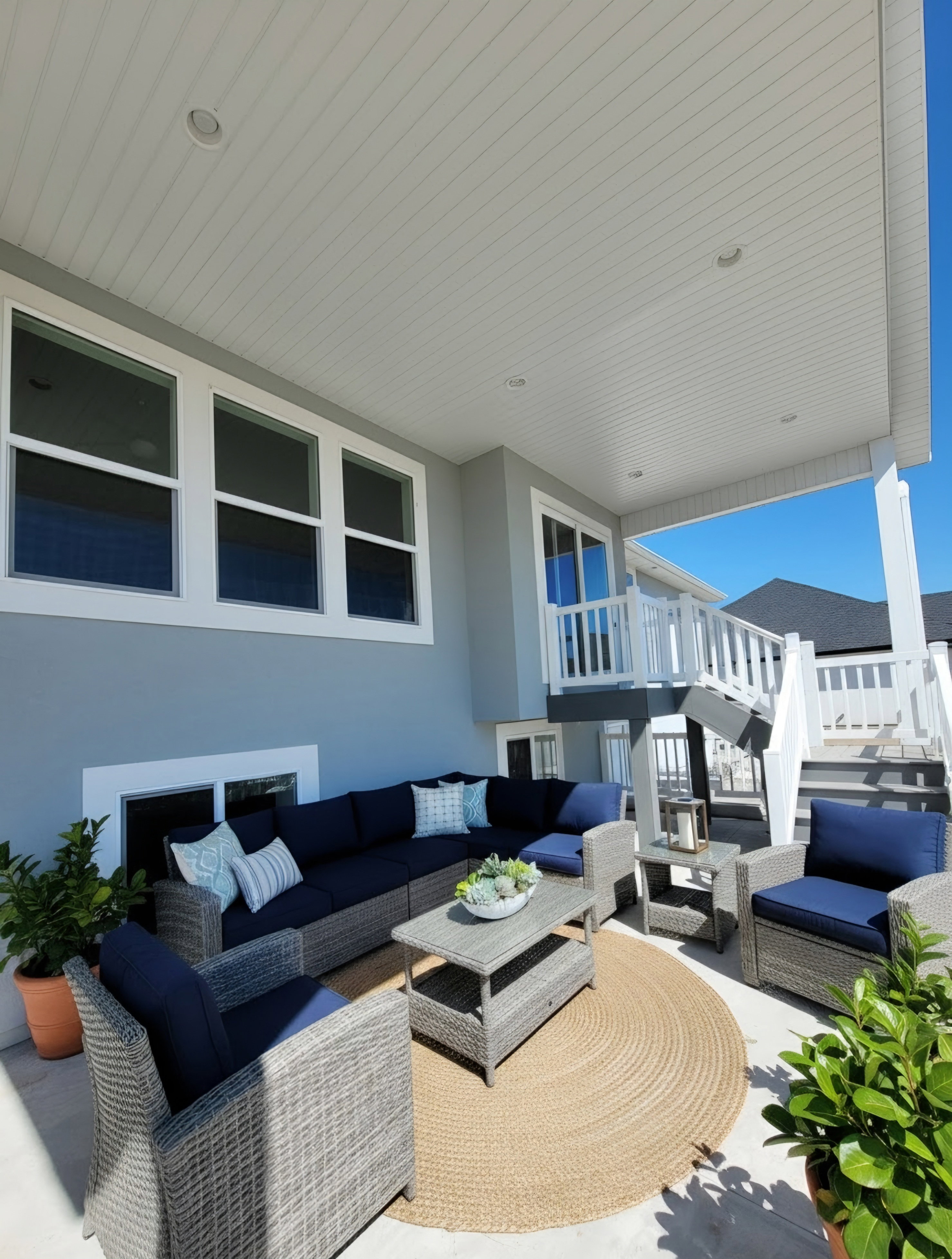 Covered patio featuring a beadboard ceiling with recessed lighting