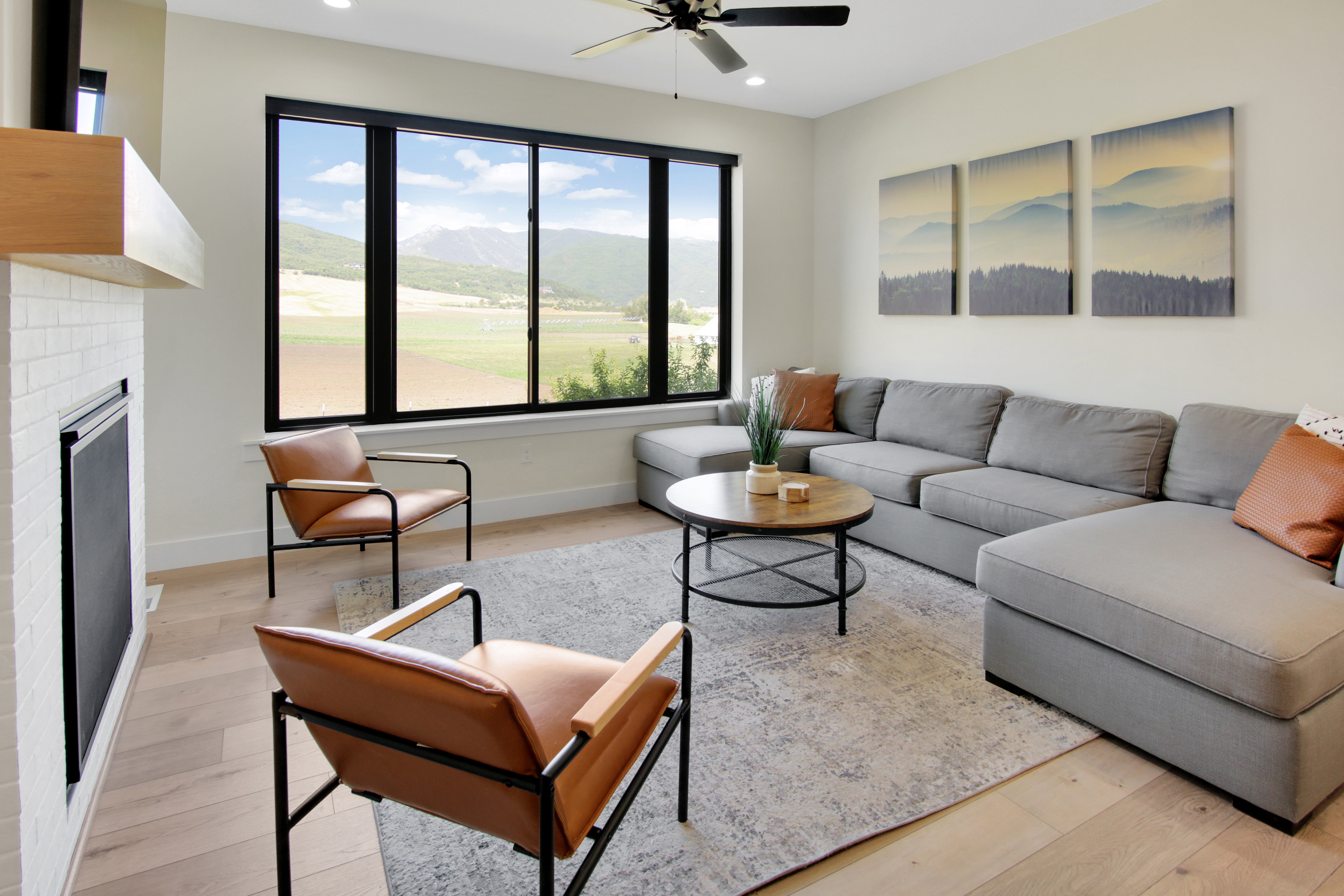 Living area featuring a floor-to-ceiling window offering expansive scenery