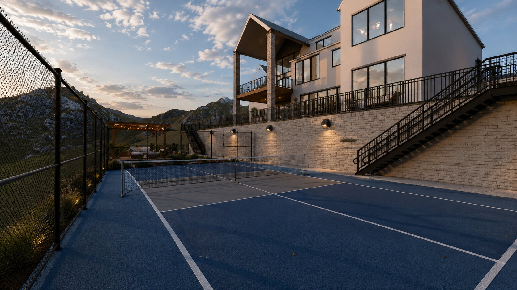 Multi-sport court with blue and gray surfacing, chain-link fencing, and integrated ground lighting