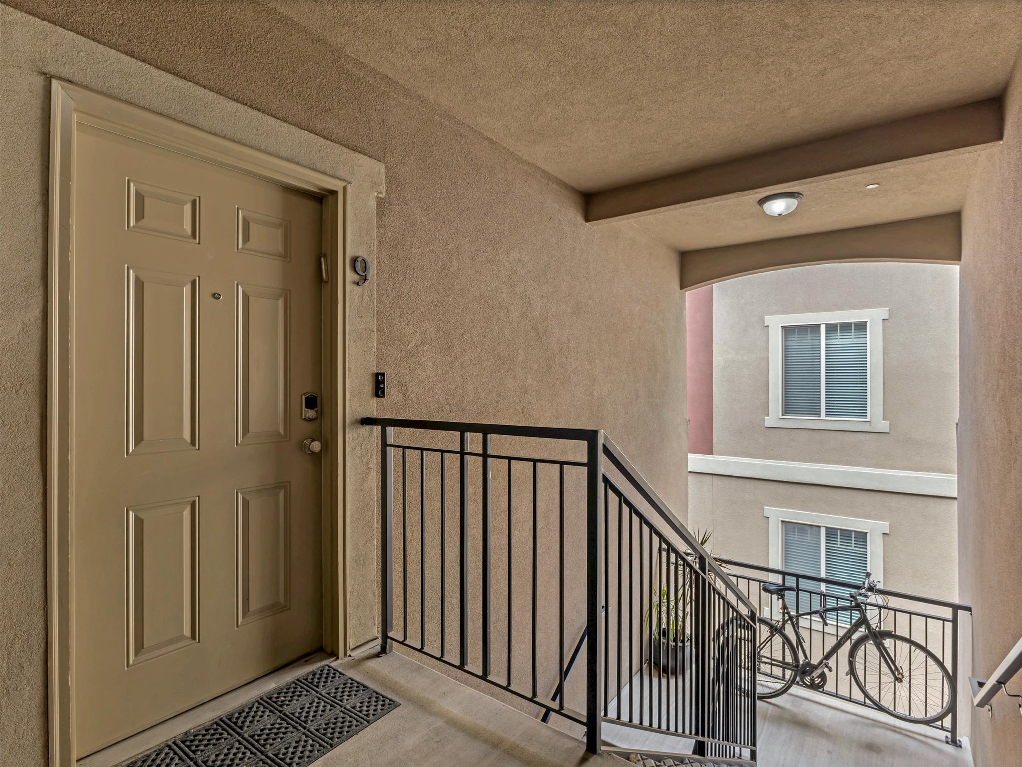 Entryway featuring a panel door with smart lock hardware