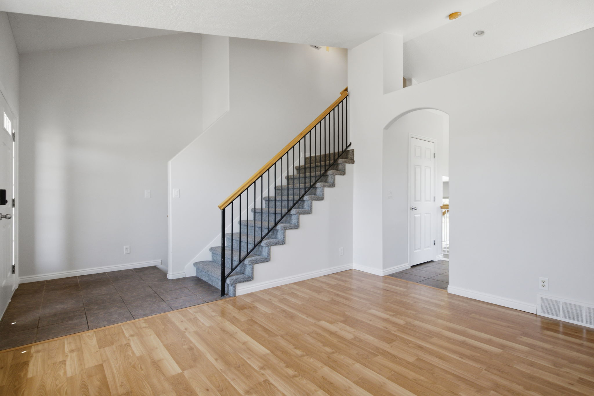 Light wood-finish flooring extending into the main living area