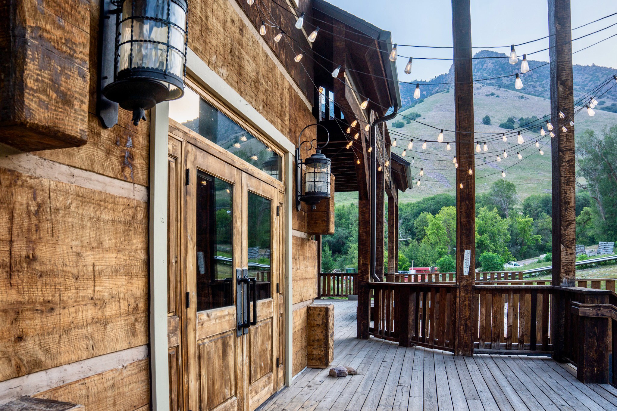Wood-paneled exterior featuring double glass-paneled doors