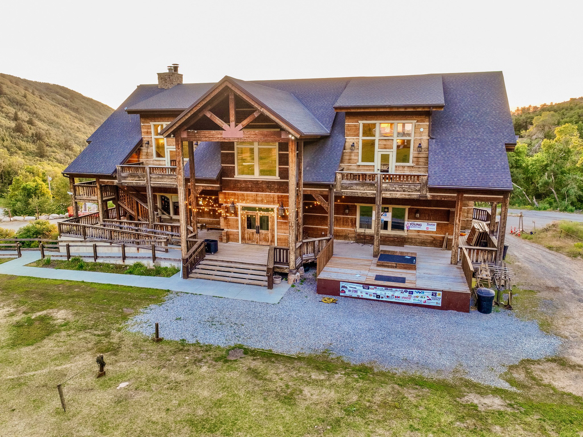 Expansive log cabin-style property featuring multiple balconies and covered porches