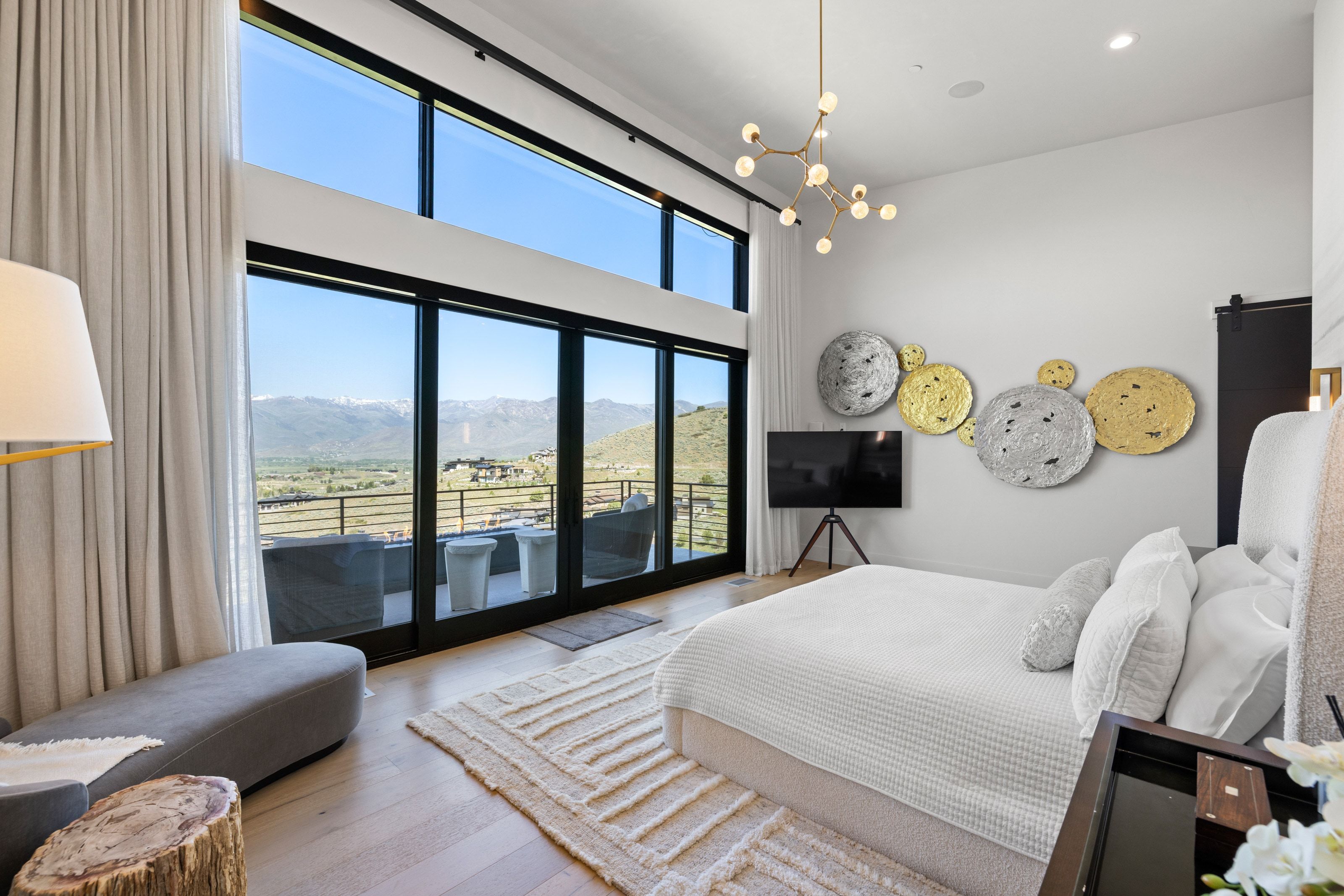 Floor-to-ceiling windows with mountain scenery