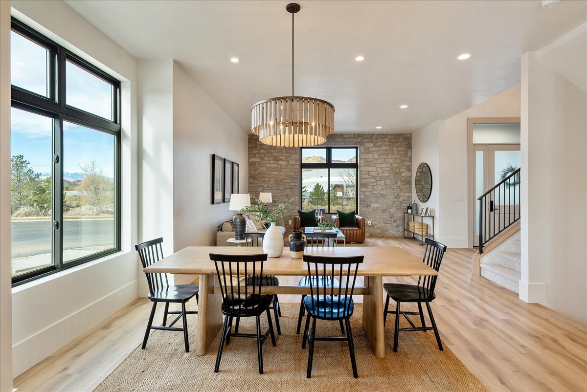 Open-concept living space with light wood-finish flooring