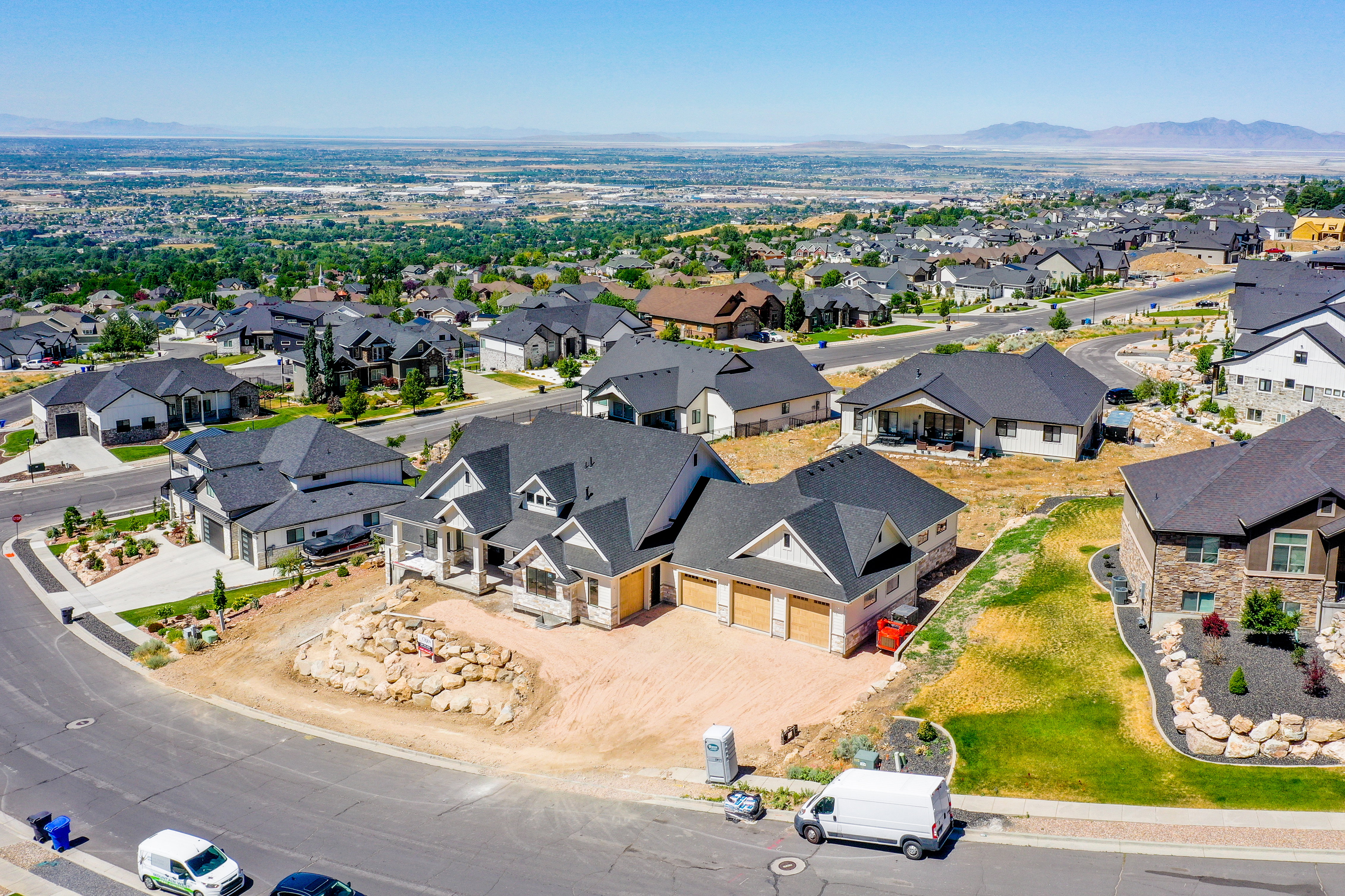 Expansive aerial perspective showcasing a residential neighborhood with varied architectural styles
