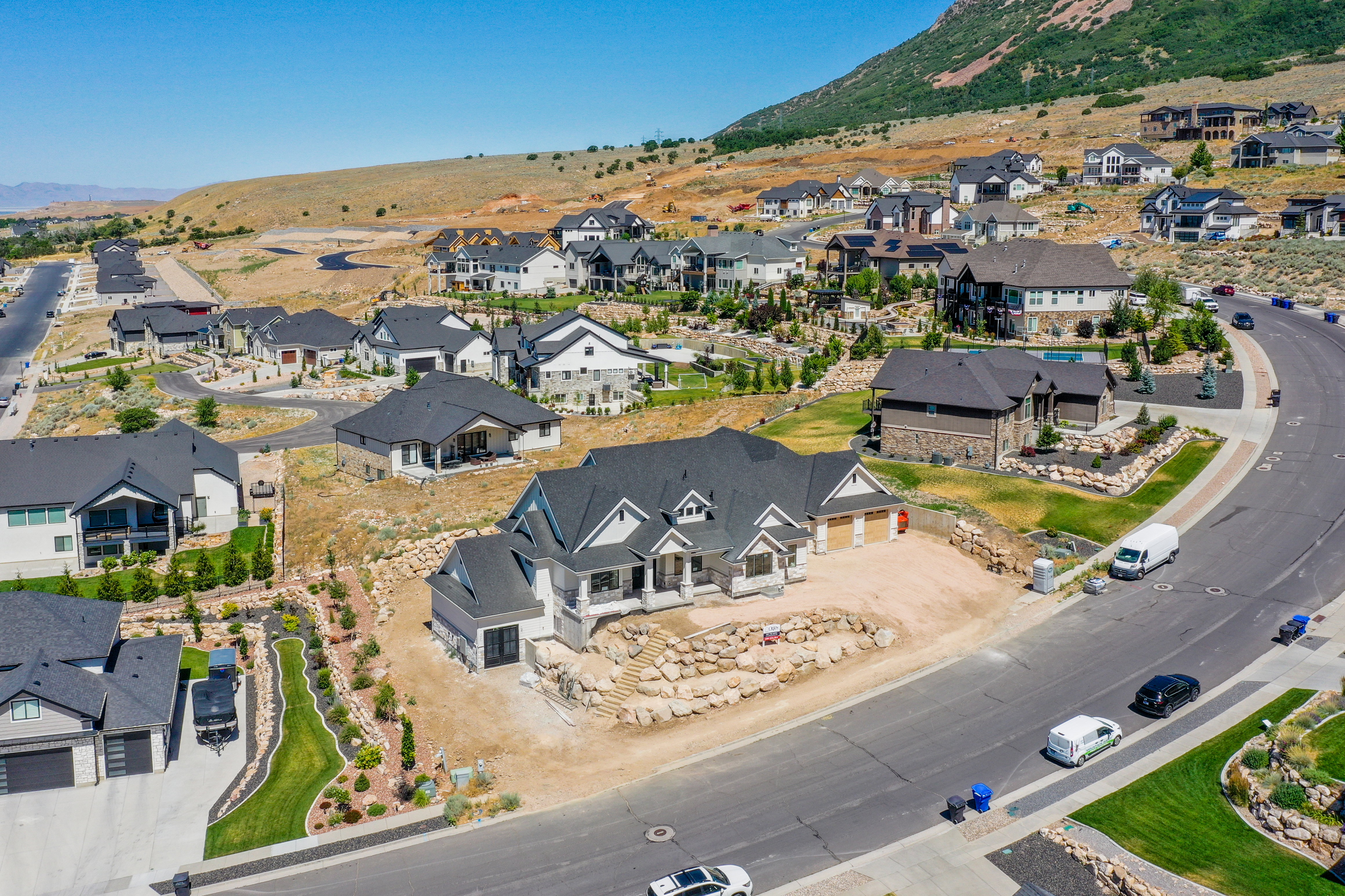 Newly constructed residence featuring a light gray and white exterior