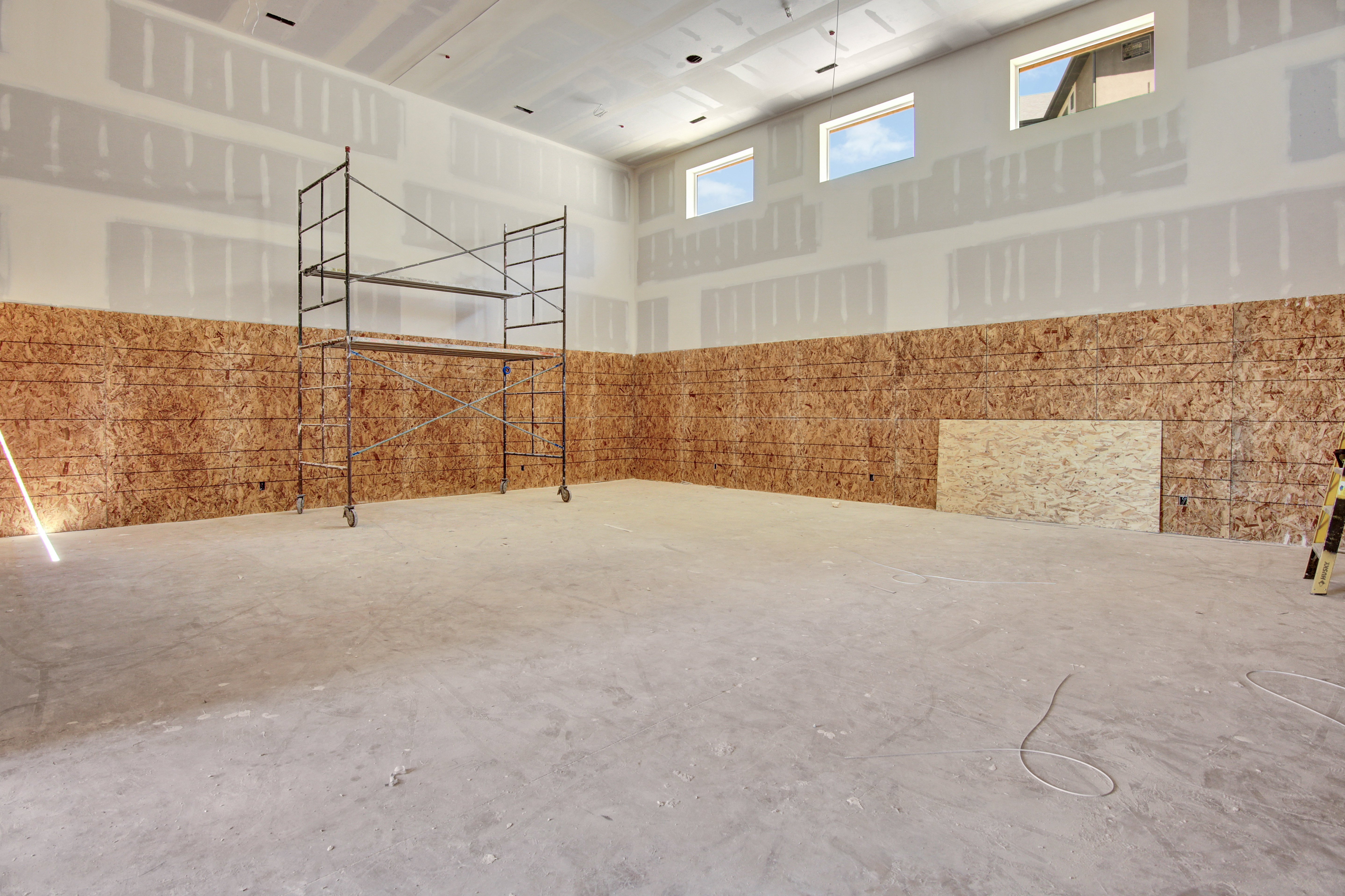 Basketball court, pickle ball, gym kids playground. walls will be carpet up for durability with epoxy floors. Garage door opening to pool