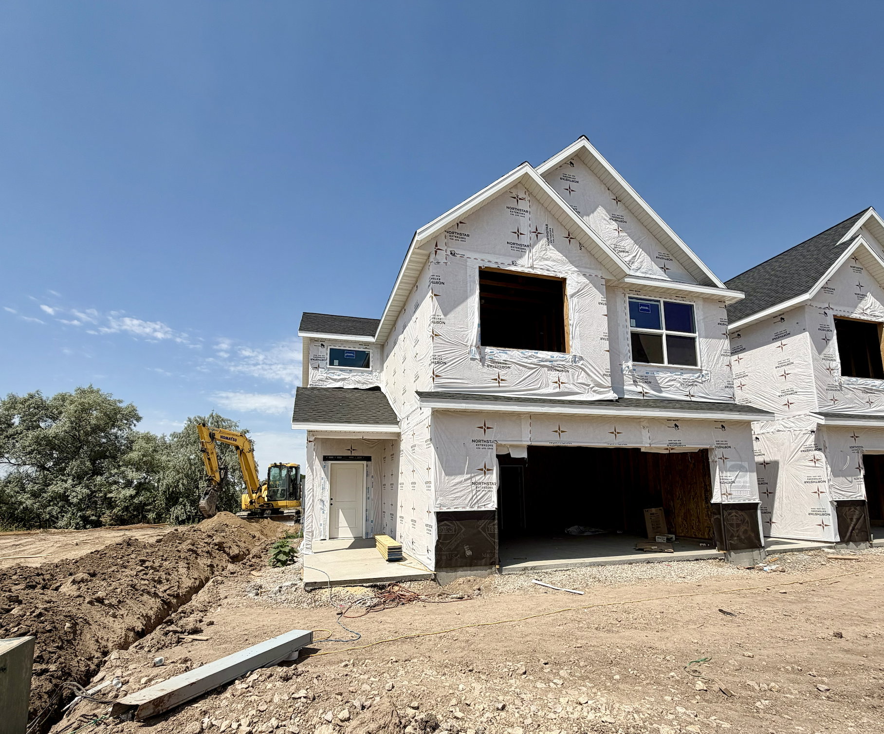 New construction home featuring a two-story design and an integrated garage