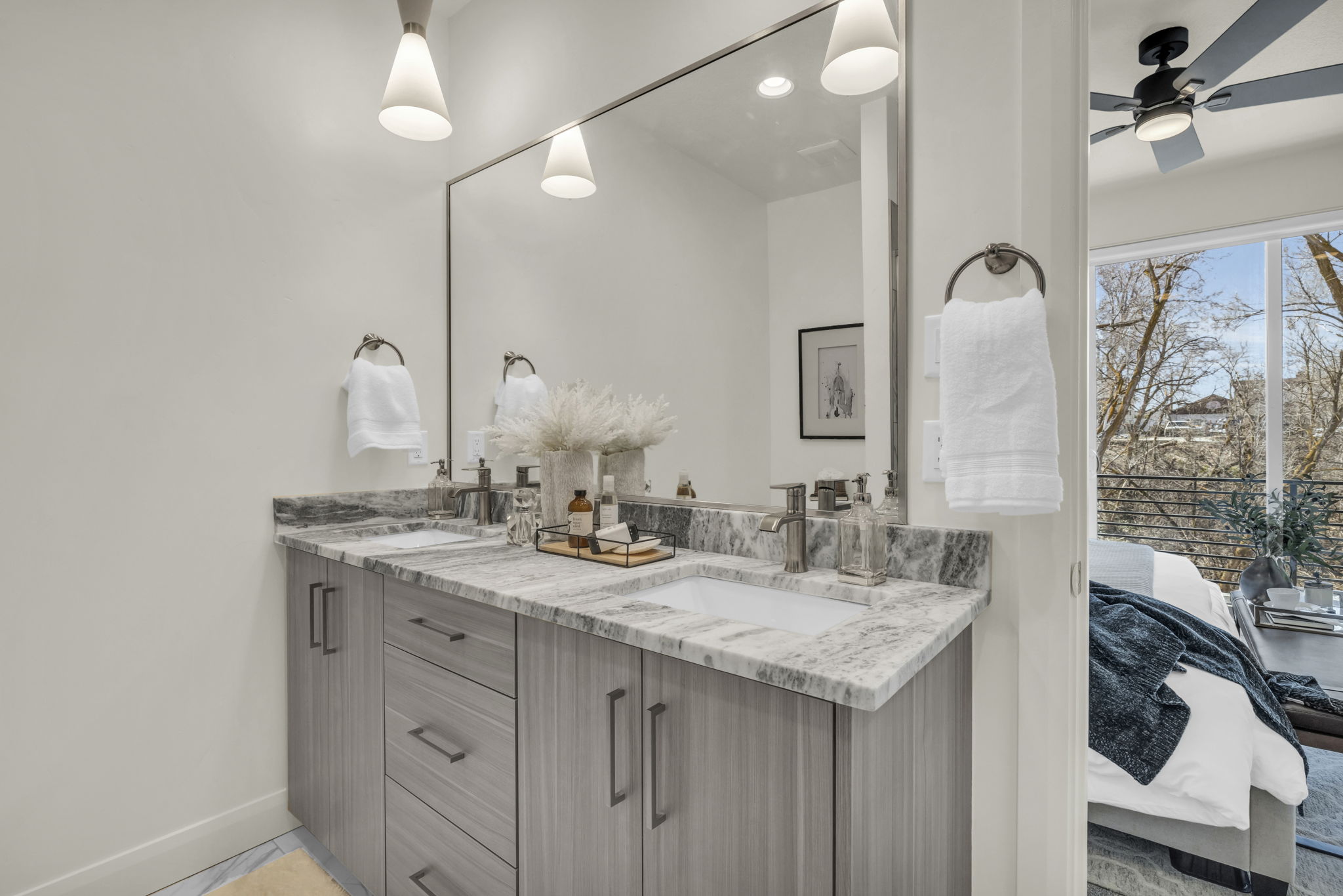 Double vanity with integrated sinks and a stone countertop