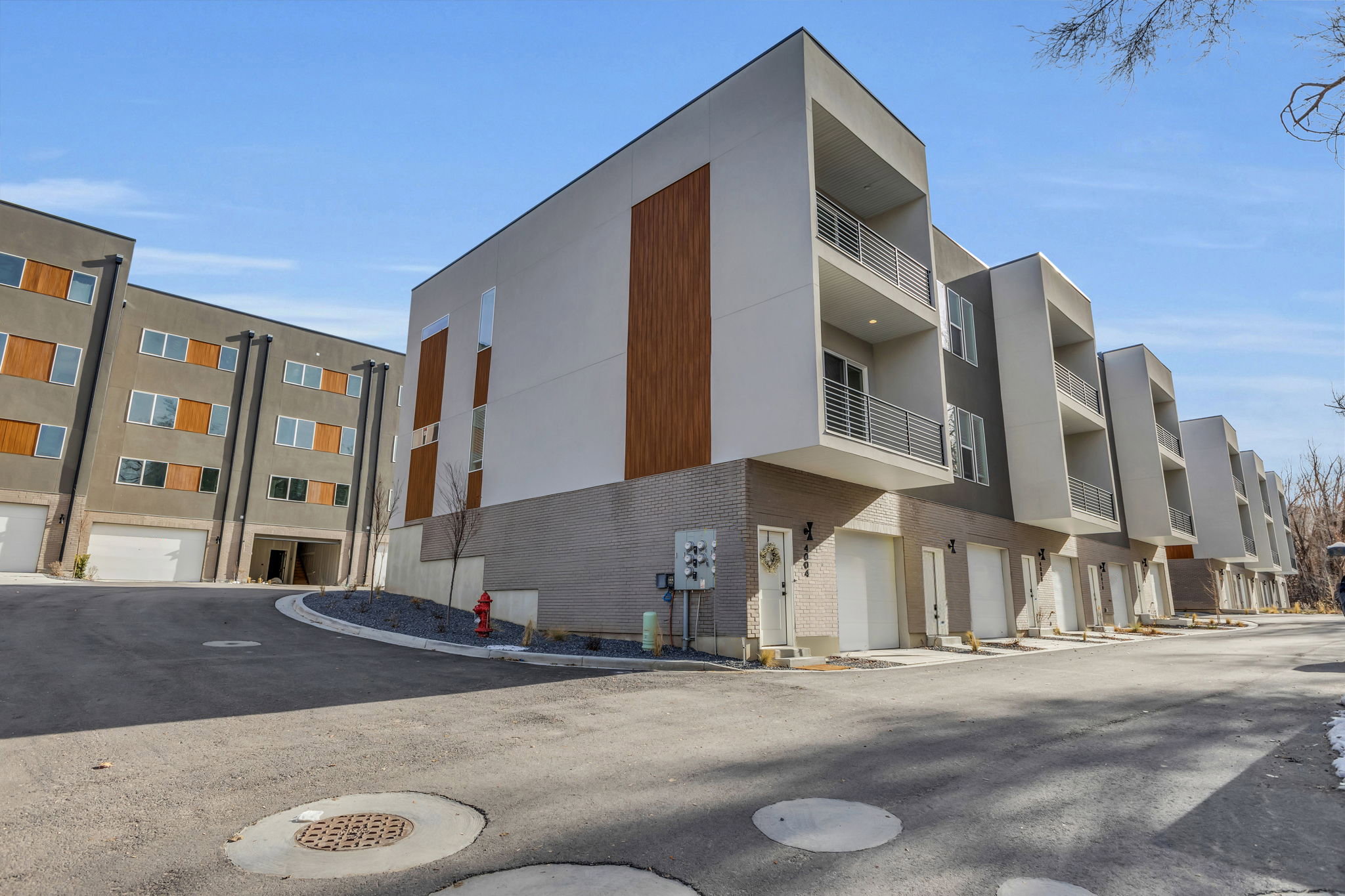 Modern townhome complex featuring a clean architectural design