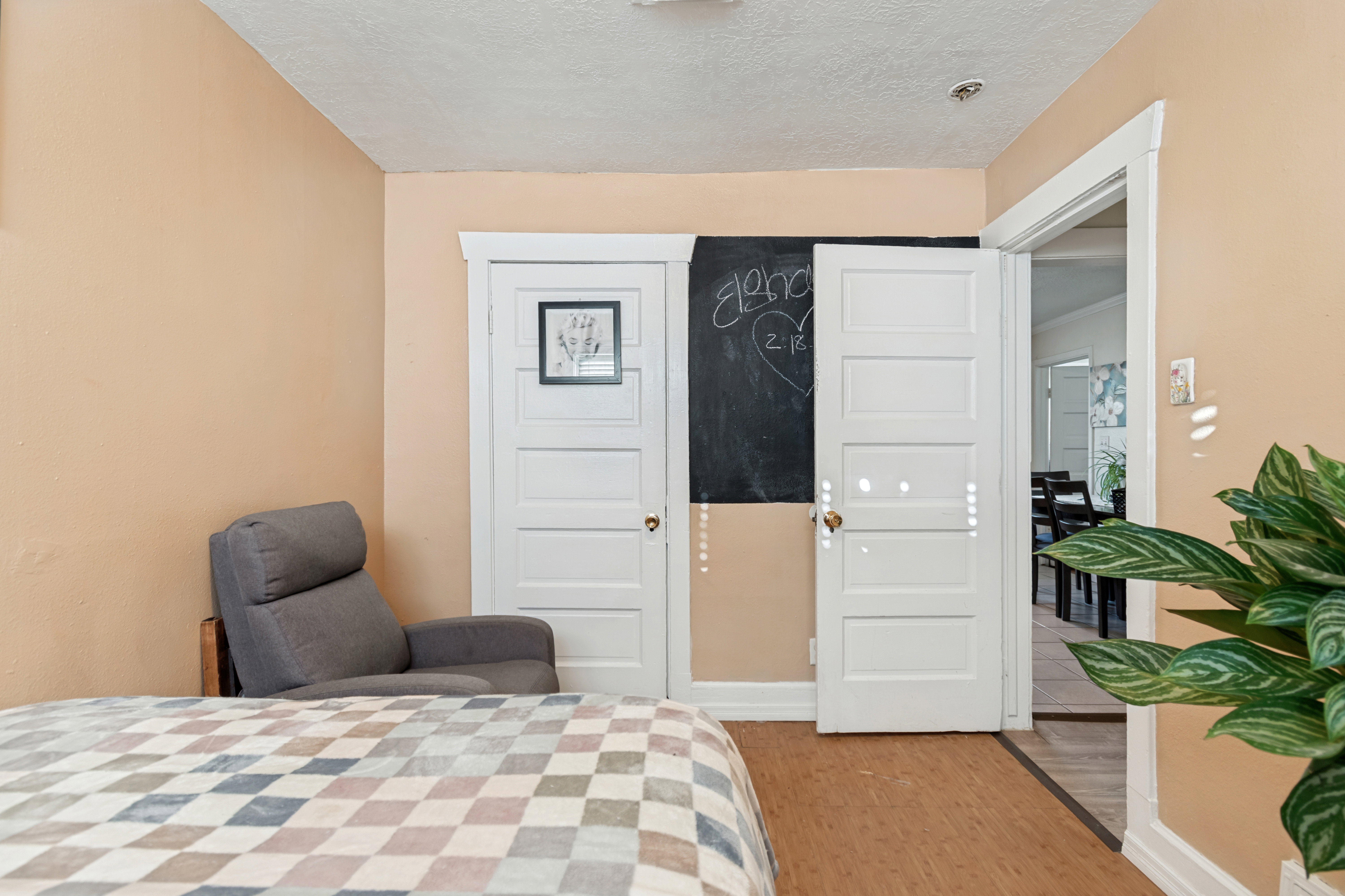 Room featuring neutral-toned walls, white trim, and a textured ceiling