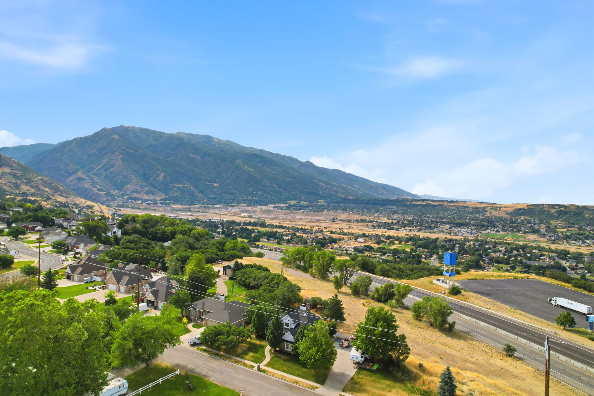 Expansive valley setting with a prominent mountain backdrop