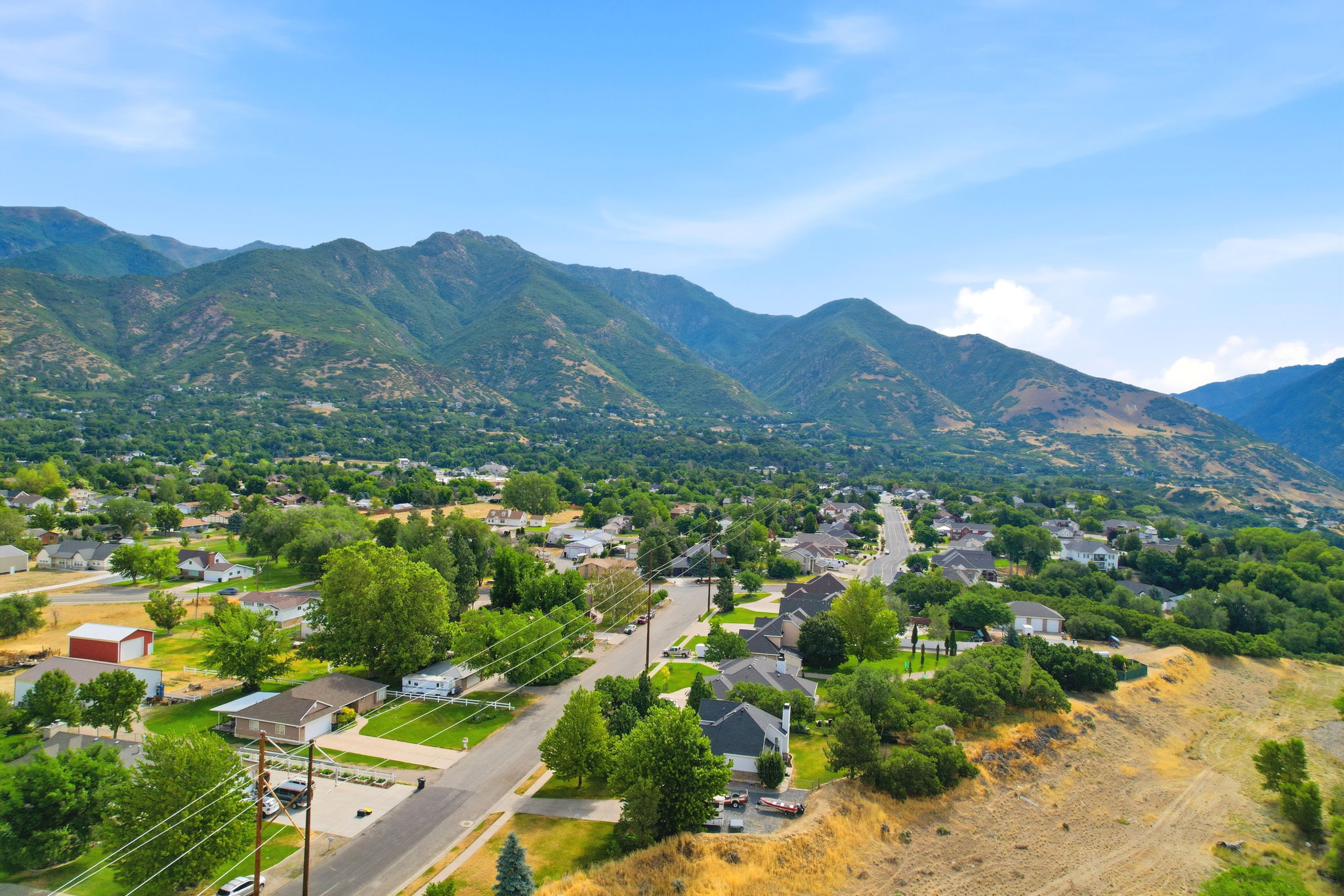 Expansive mountain range backdrop framing a residential neighborhood