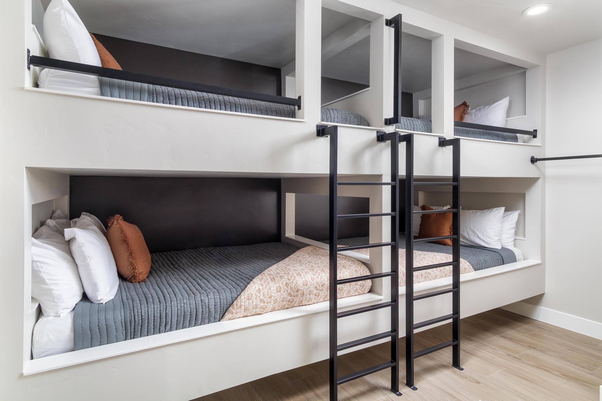 Built-in bunk beds with integrated ladders and safety rails