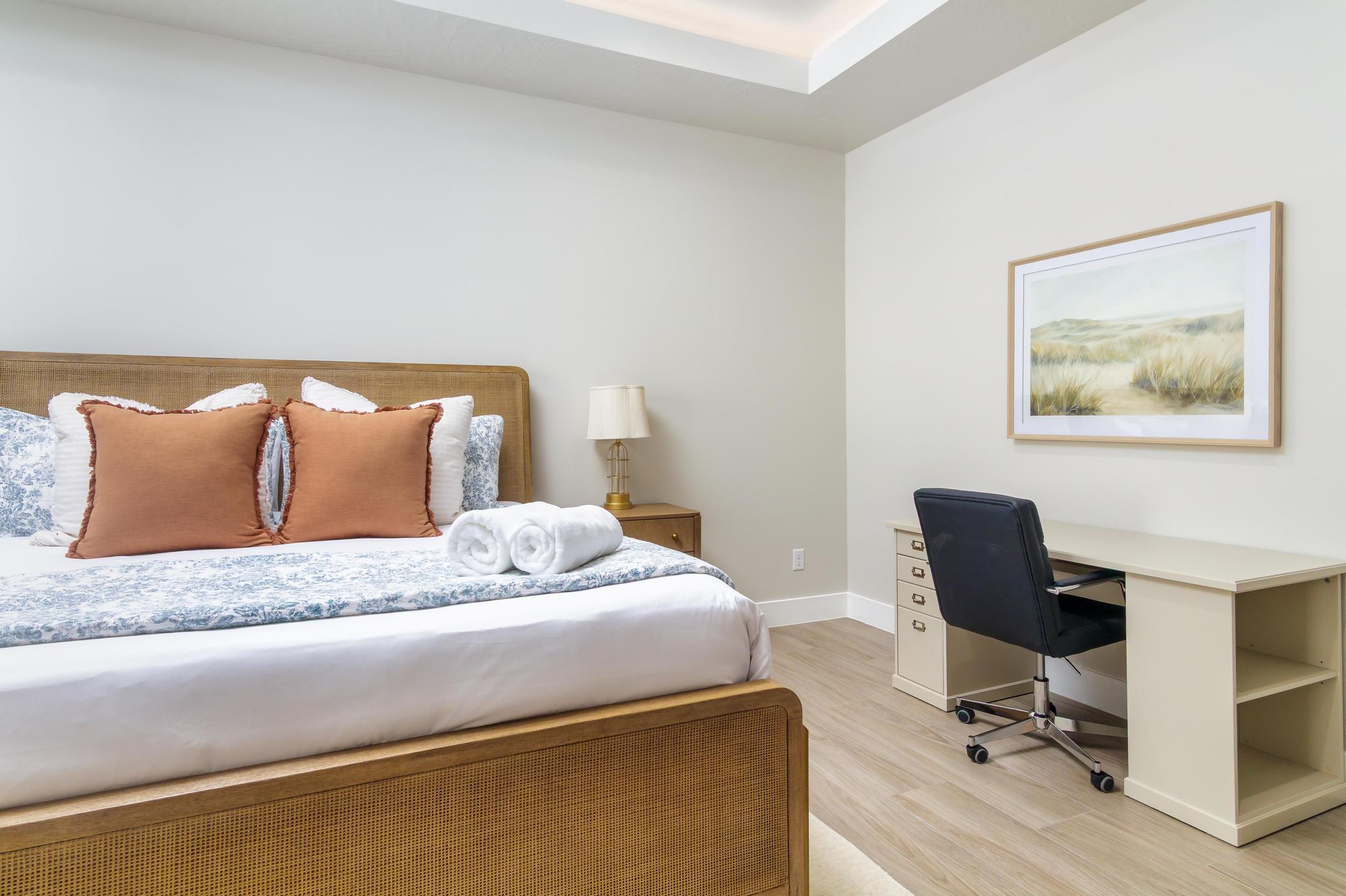 Tray ceiling, wood-finish flooring, and light-toned walls