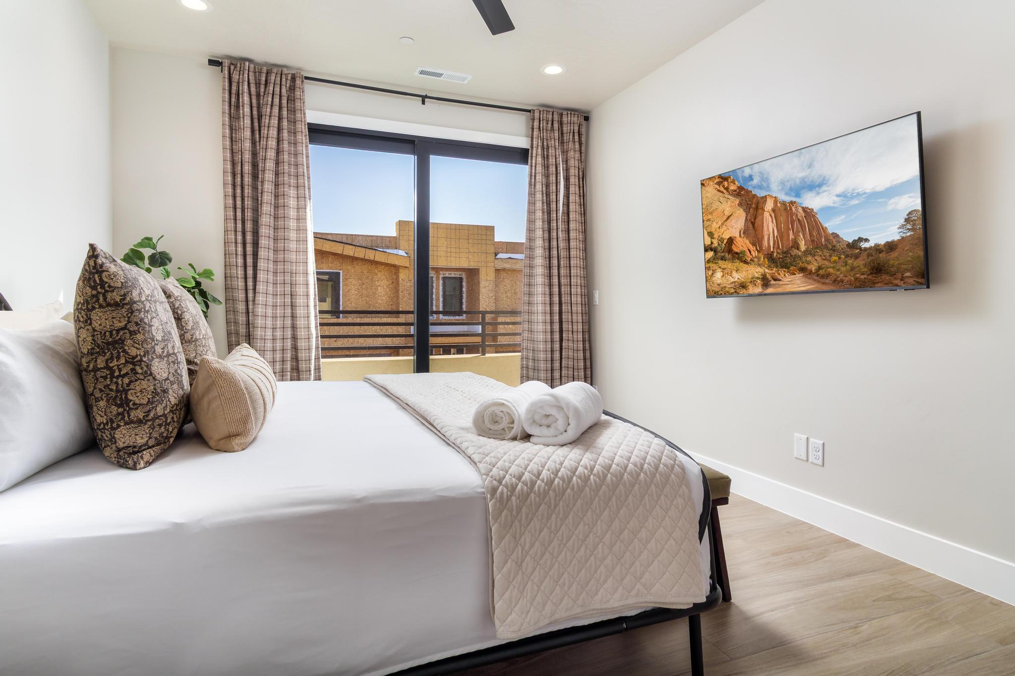 Bedroom featuring wood-finish flooring and a ceiling fan