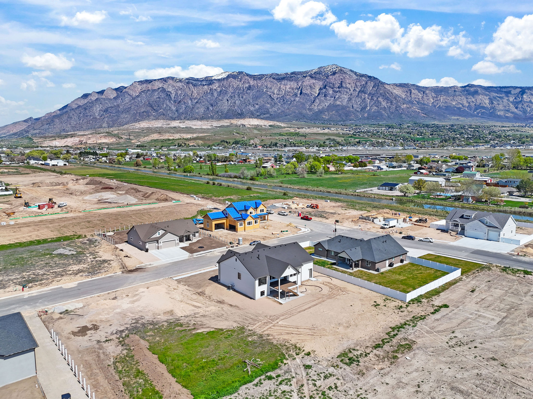 New construction property featuring a covered back patio and a two-car garage